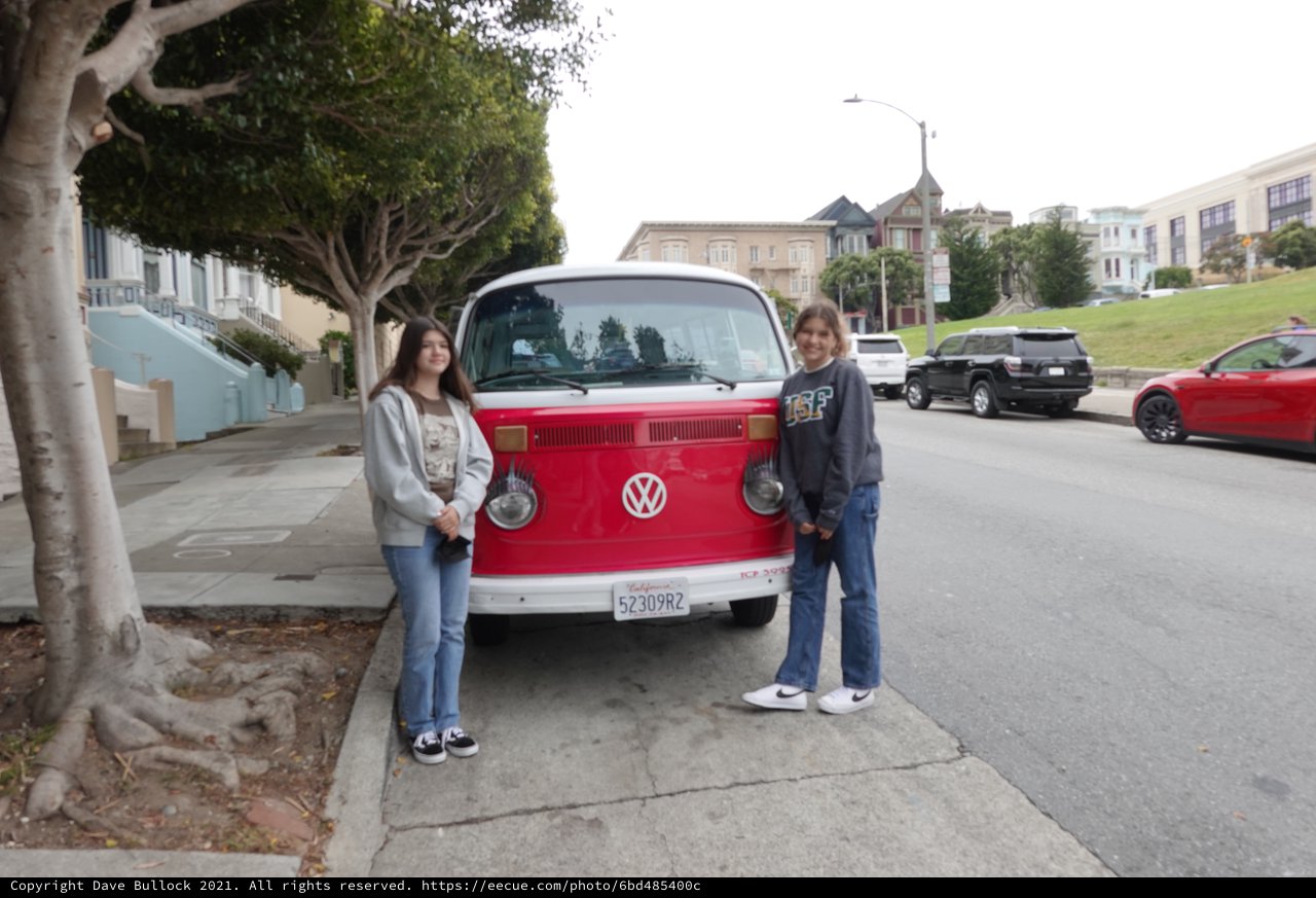 Friends Posing with Classic Volkswagen Bus