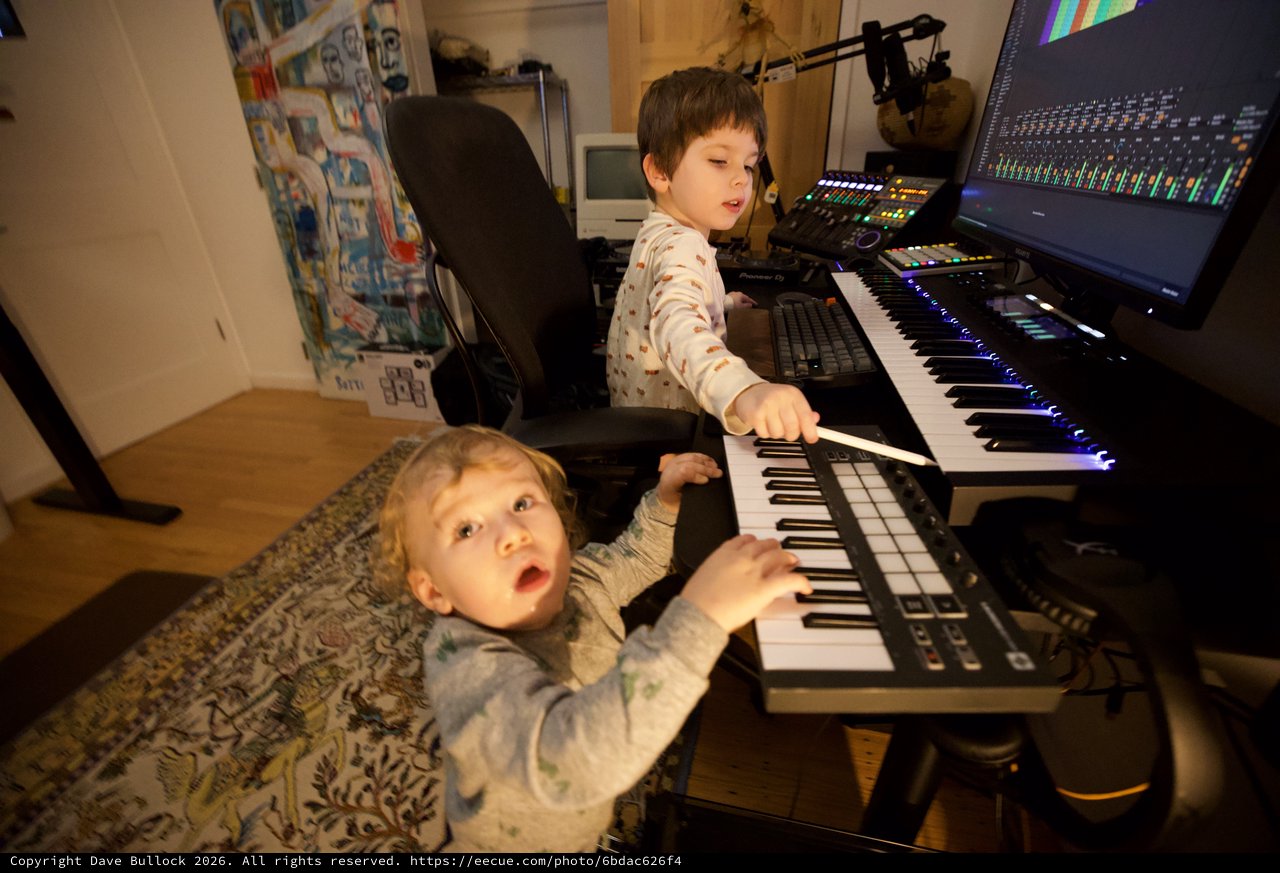 Two Young Brothers Making Music Together at Home Studio