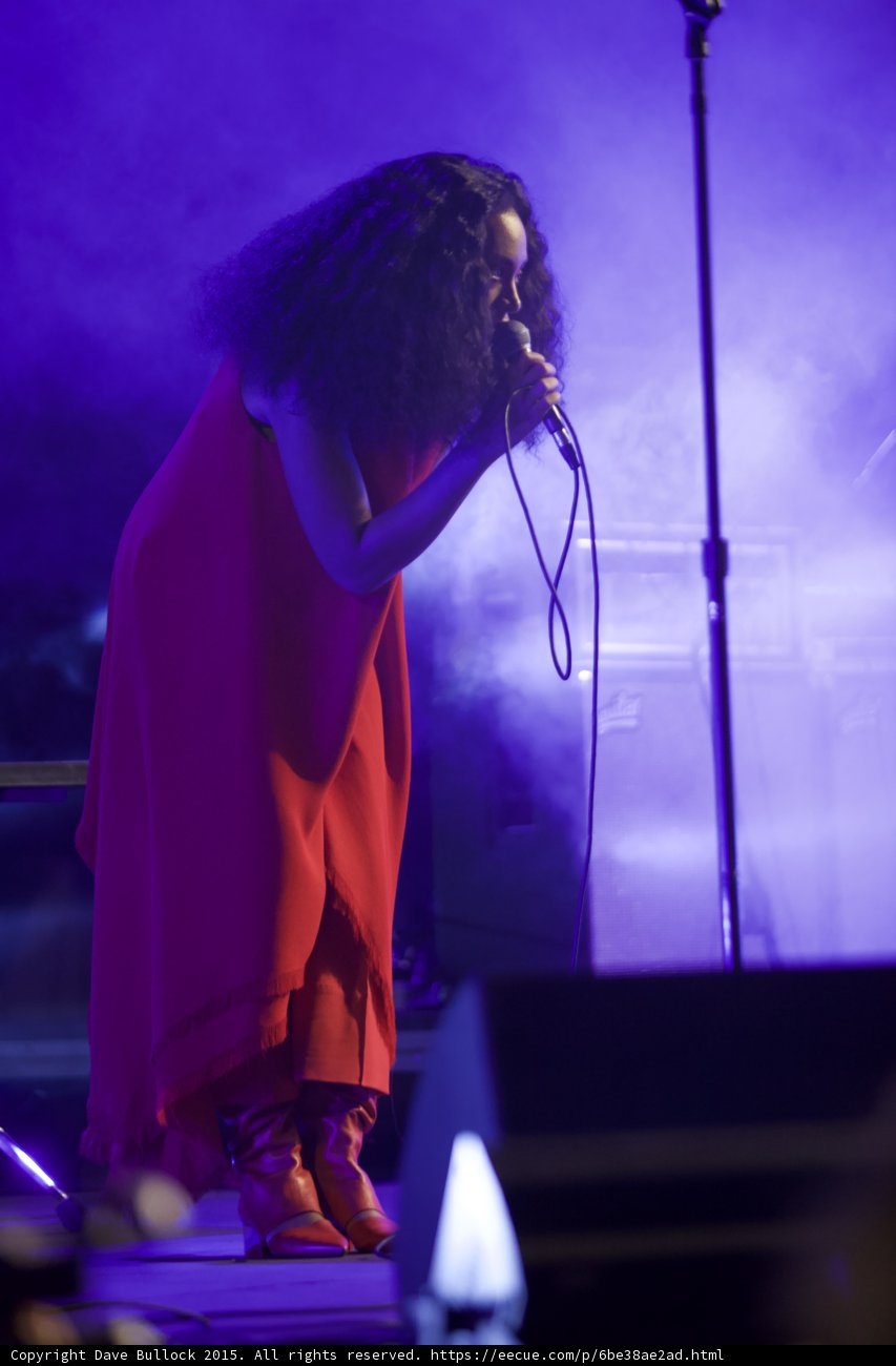Solange Full Body Side View Red Dress Red Boots Stage