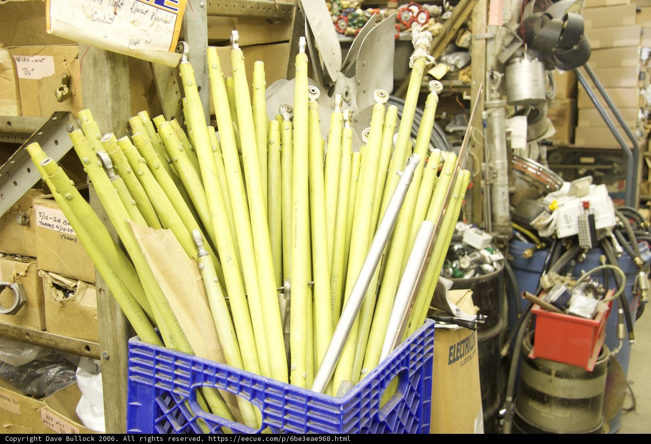 Green Sticks in Blue Basket