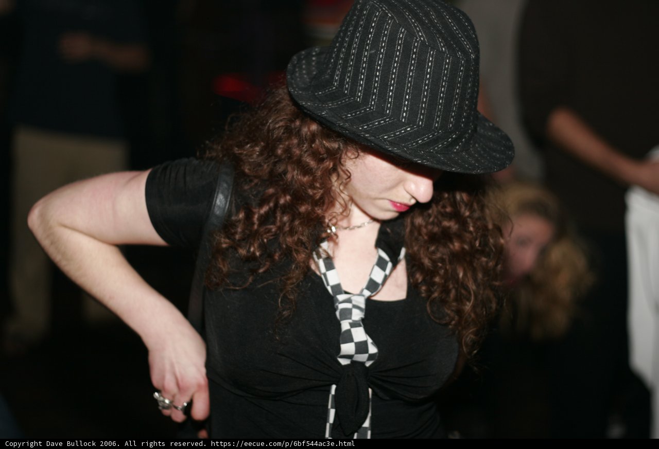 Chic Woman in Sun Hat and Black Shirt