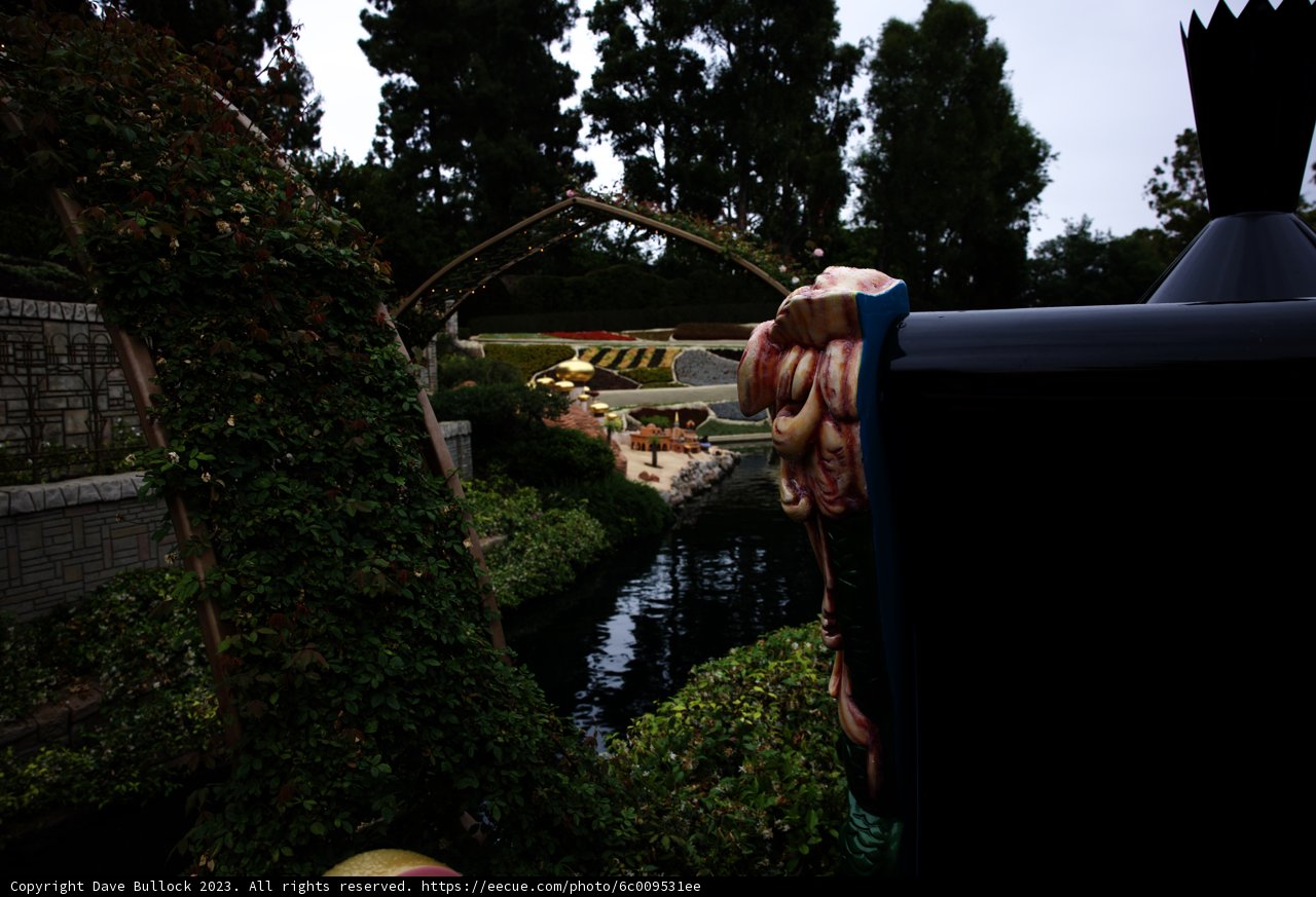 Serene Waterway with Majestic Statue