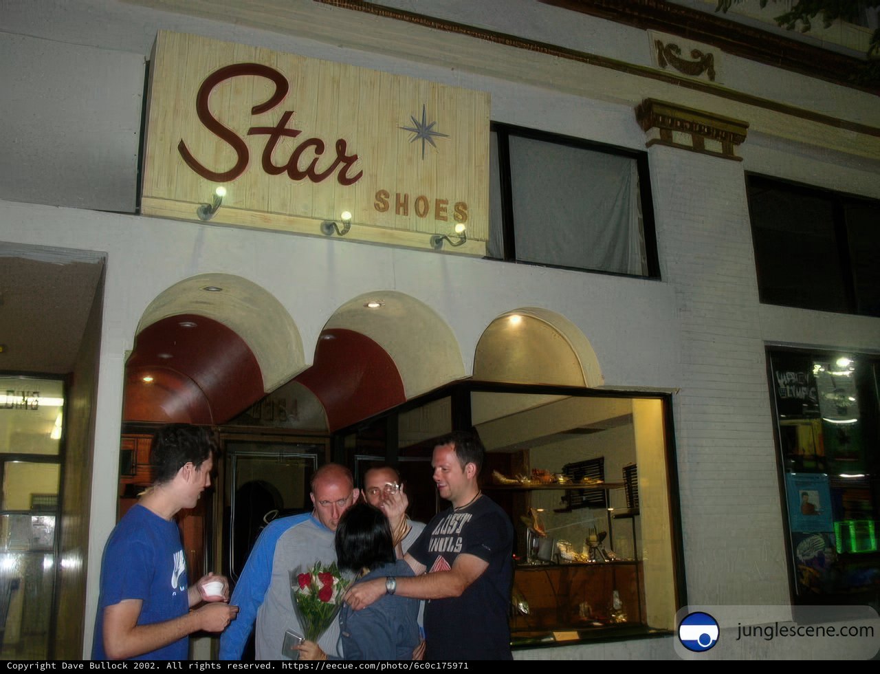 People Gather Outside Star Shoes Store