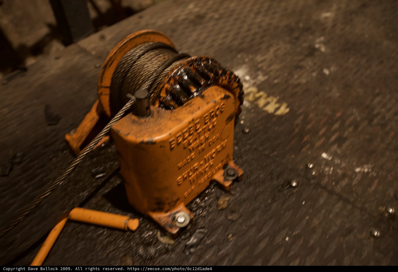 Rusty winch and worn-out rope