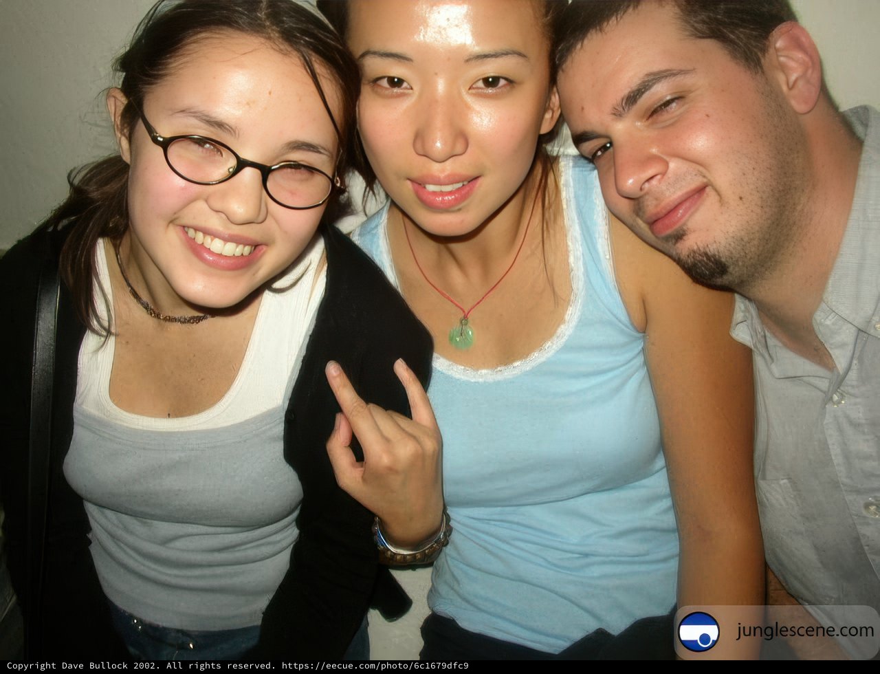Three people smiling for the camera