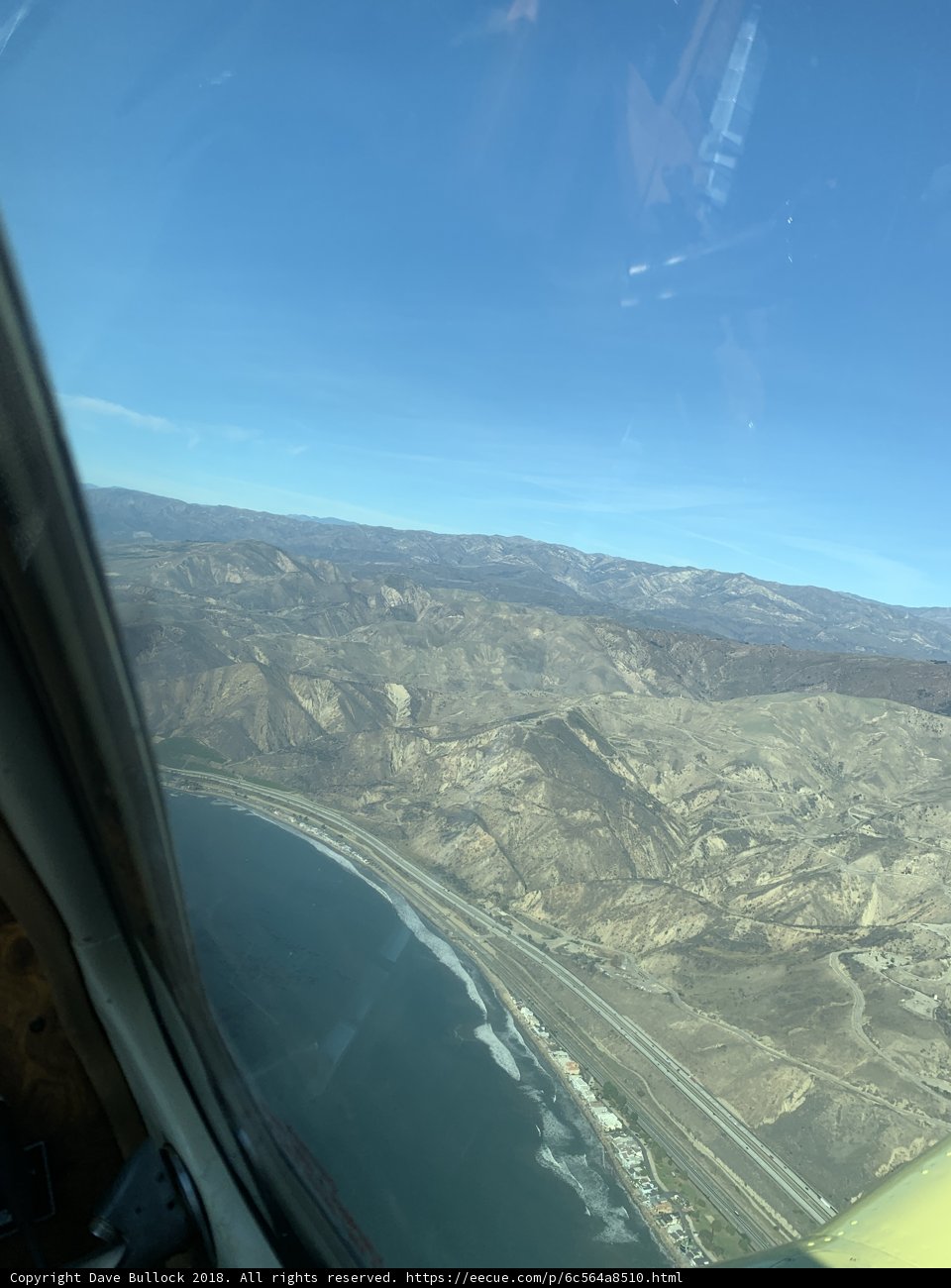 Aerial View of the Majestic Mountains and Ocean