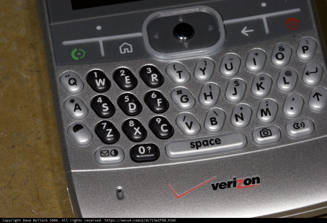 Sleek Silver Cell Phone with Black and White Keypad