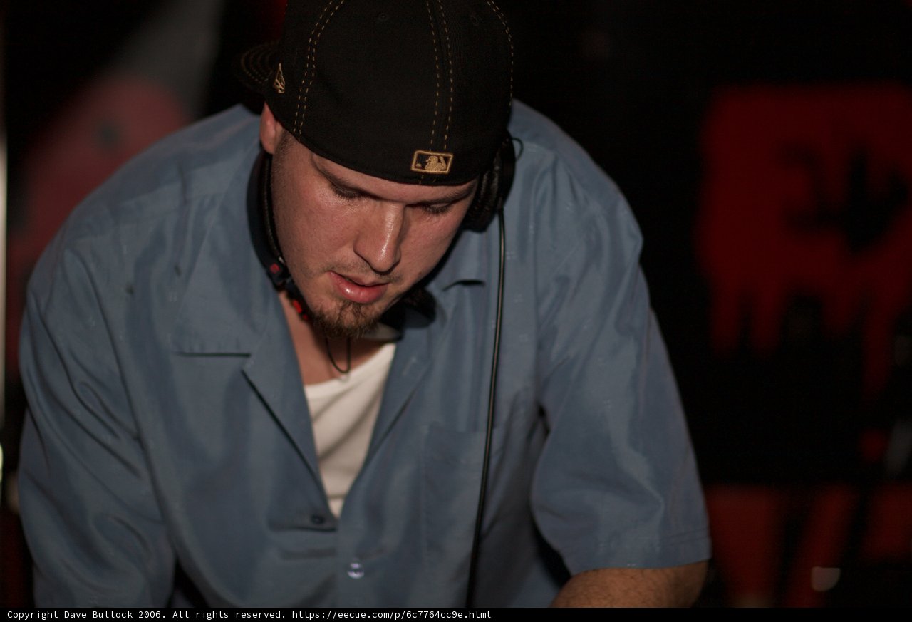Blue-Shirted Man in a Baseball Cap