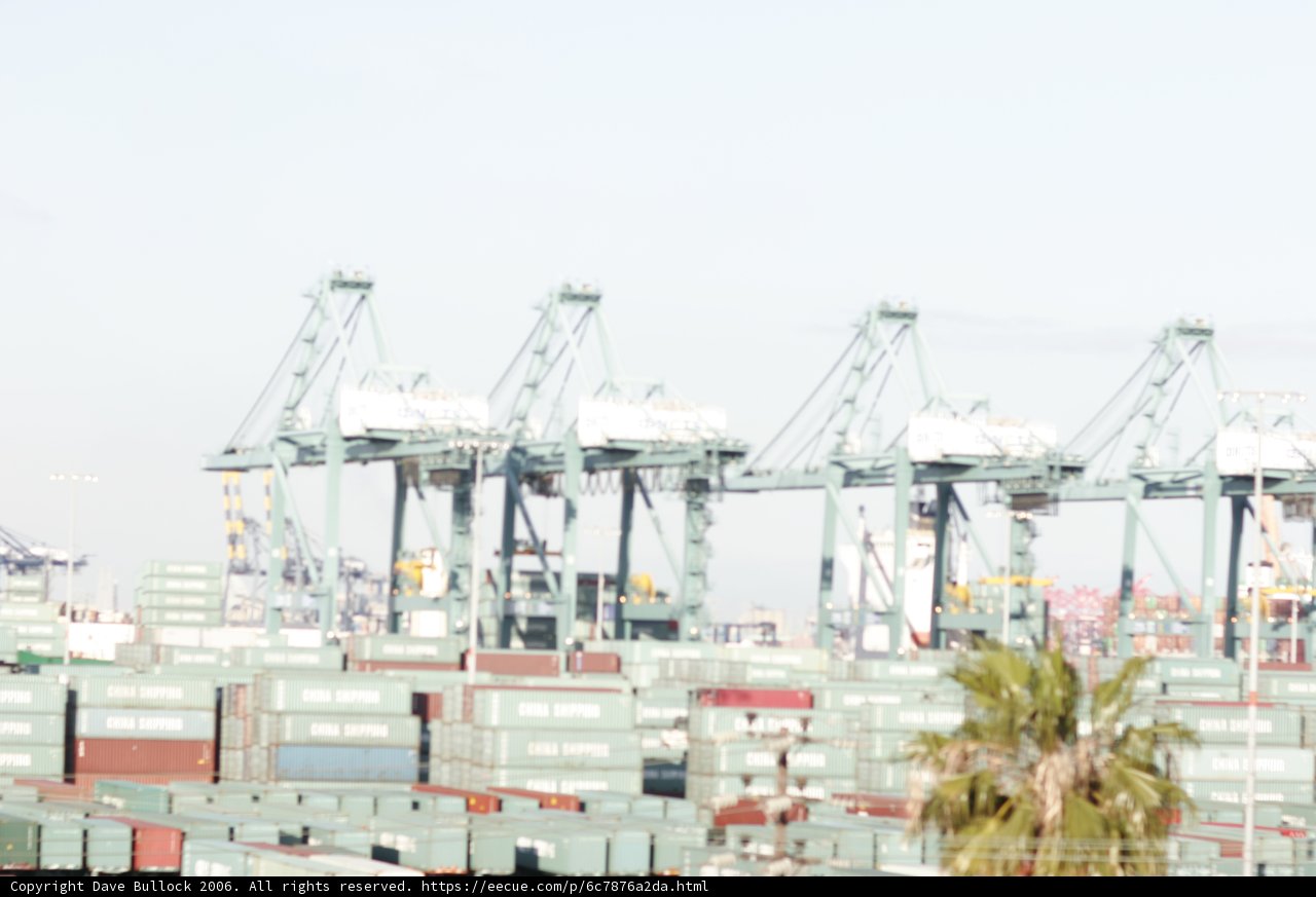 Massive Container Ship at Waterfront Terminal