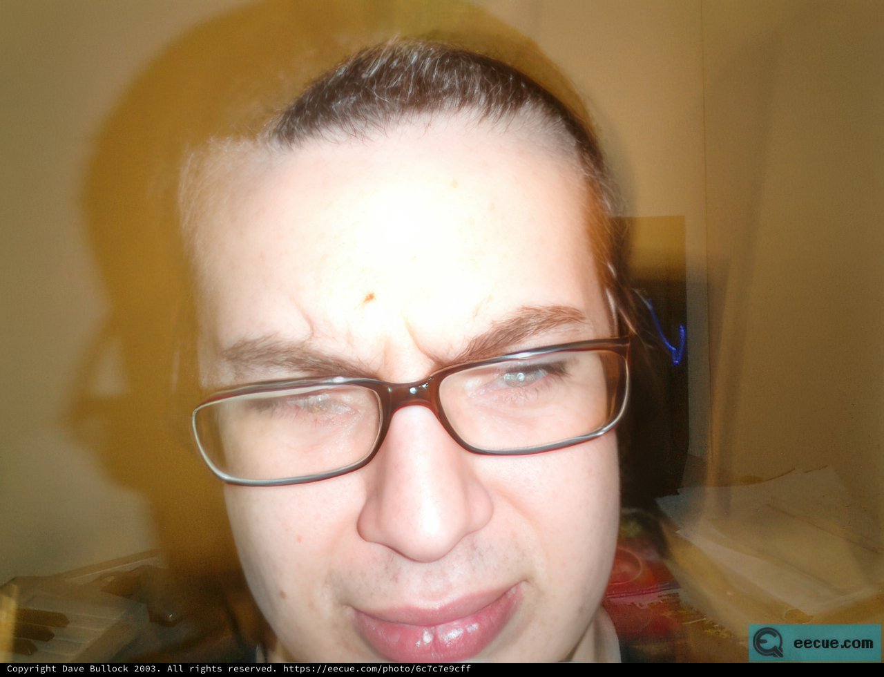 Blurry Portrait of a Sad Man with Glasses