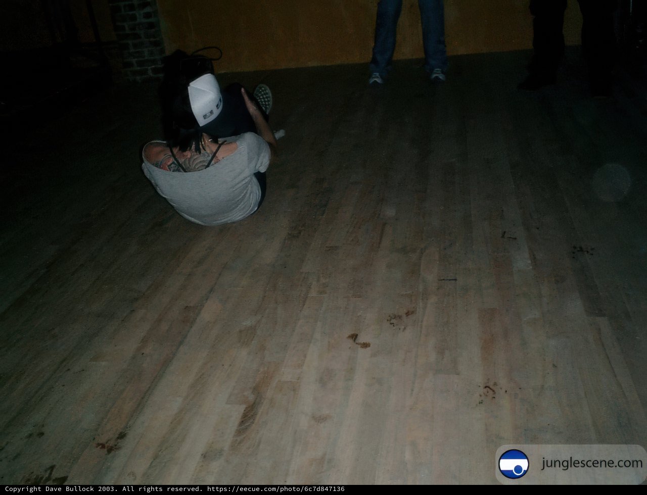 Breakdancing Trio in Dark Wooden Room