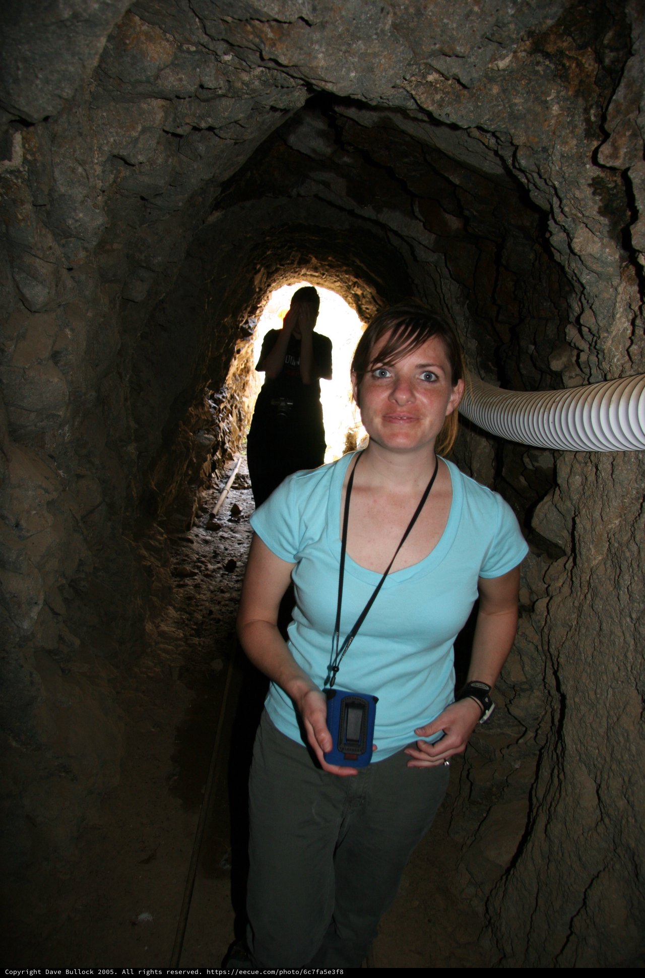 Explorer Inside Ancient Rocky Mine Tunnel Passage