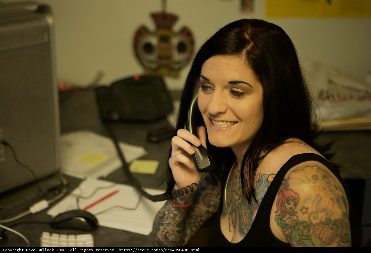 Tattooed Woman on Phone