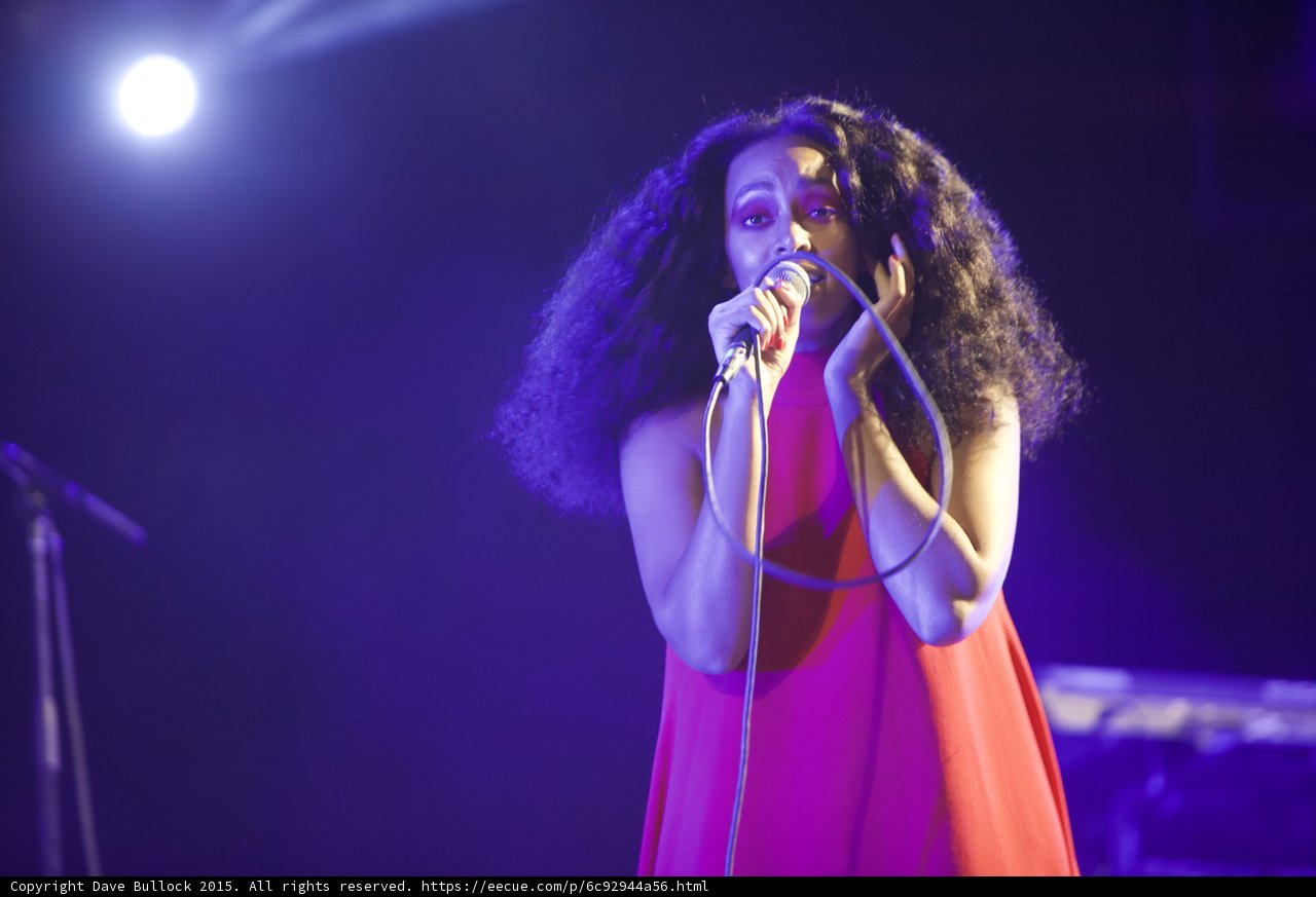 Solange Portrait Singing Hand Near Hair Spotlight Purple
