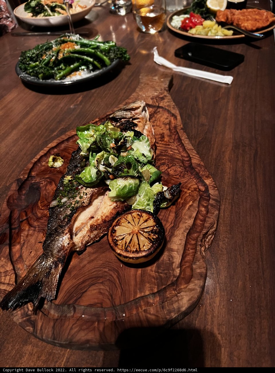 Sea Bass and Veggies on Wooden Table