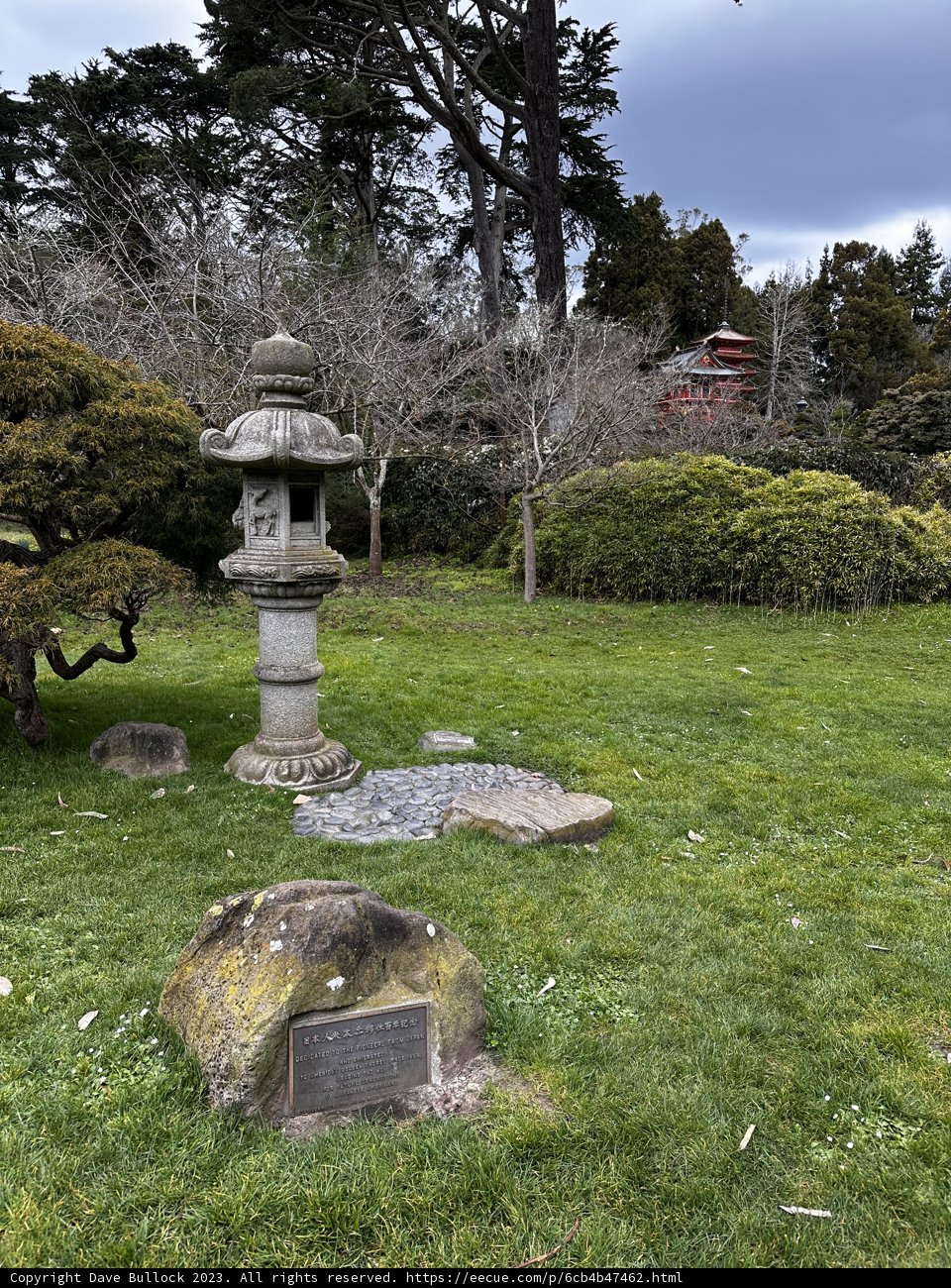 Tranquil Japanese Garden with Stone Lantern and Bench