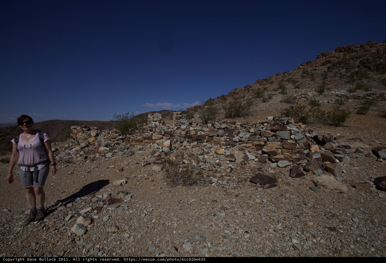 Desert Ruins: Hiker Explores Ancient Stone Structure