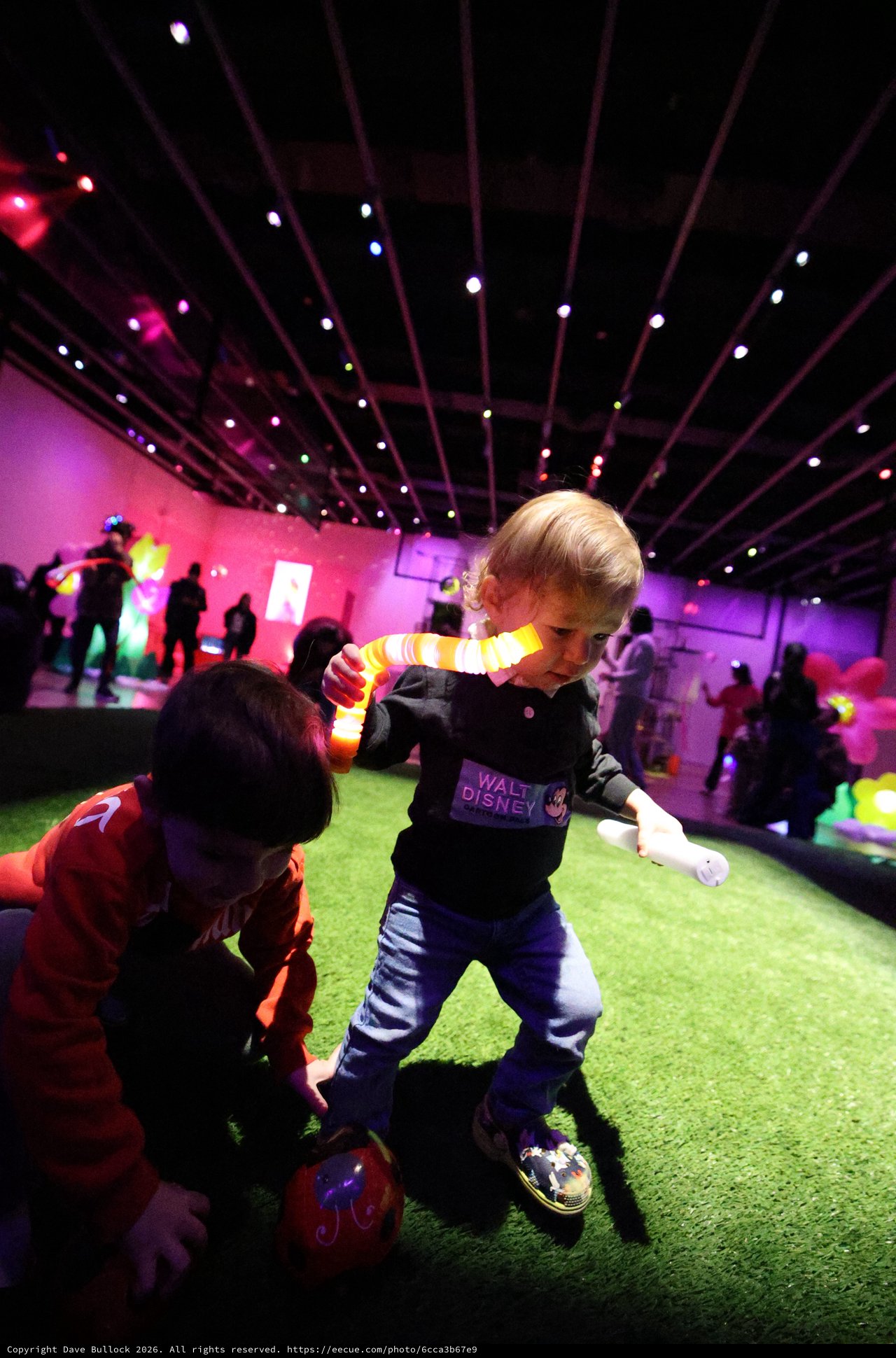 Children Playing at Baby Rave Event with Colorful Lighting