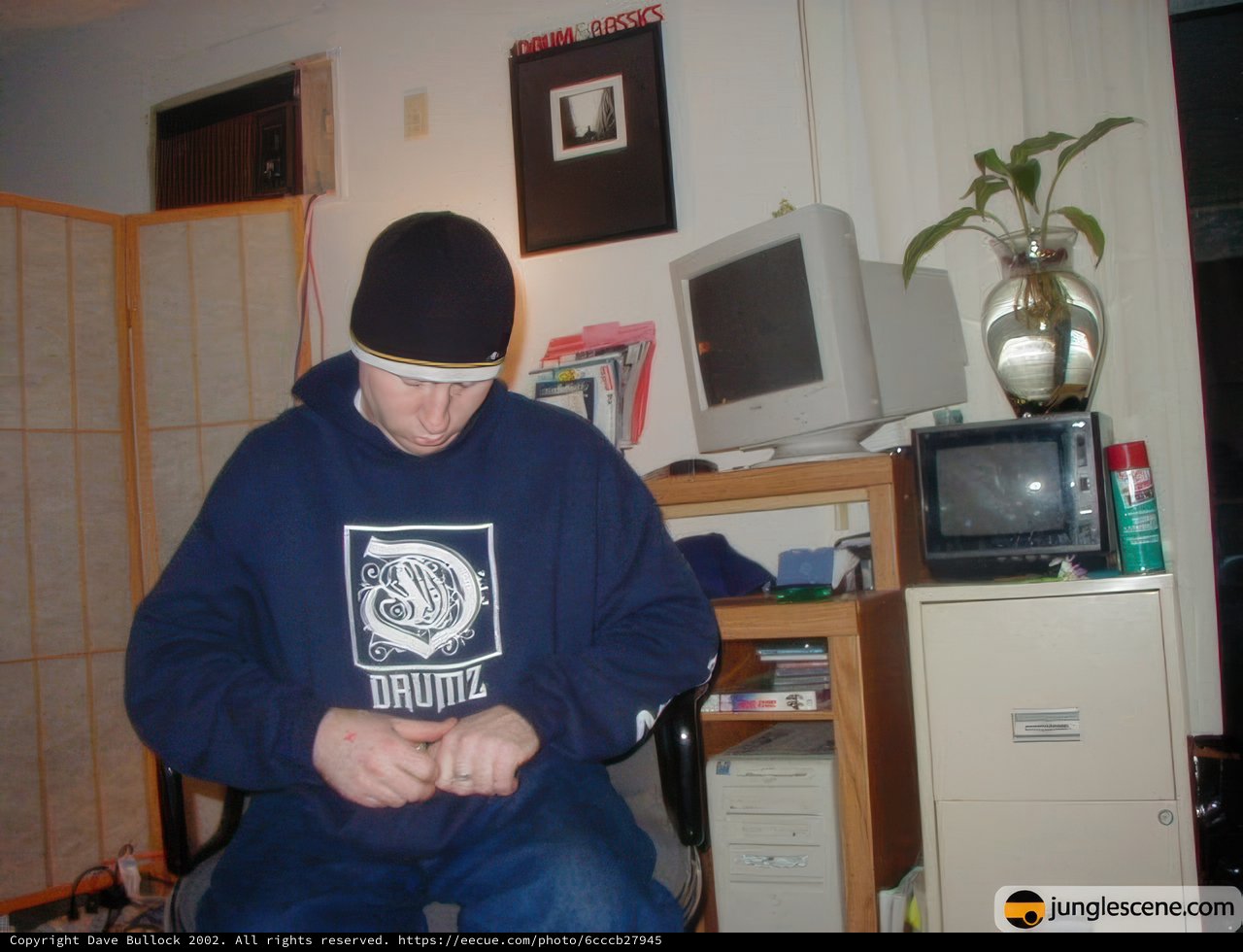 Blue Hoodie and Computer Monitors