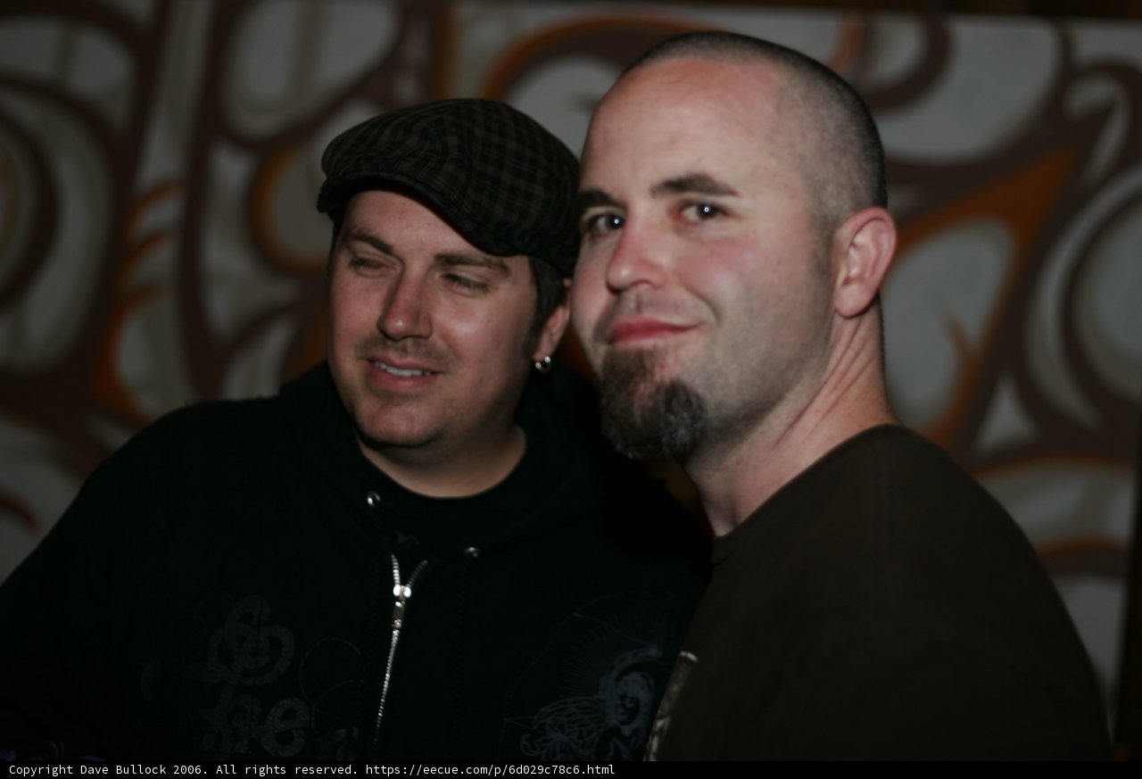 Two Men Sporting Caps and Warm Knitwear