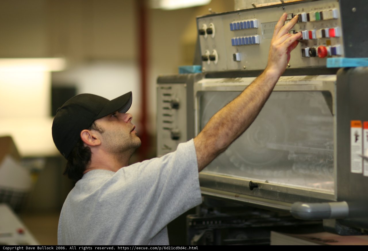 Grey-Shirted Man Rocking His Baseball Cap
