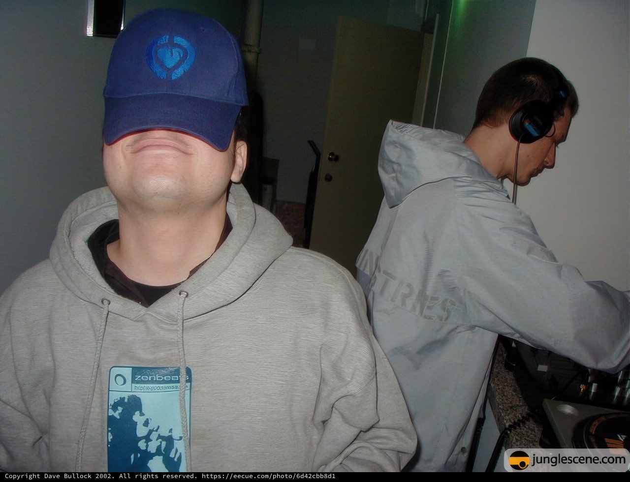 Two Men in Hats and Headphones