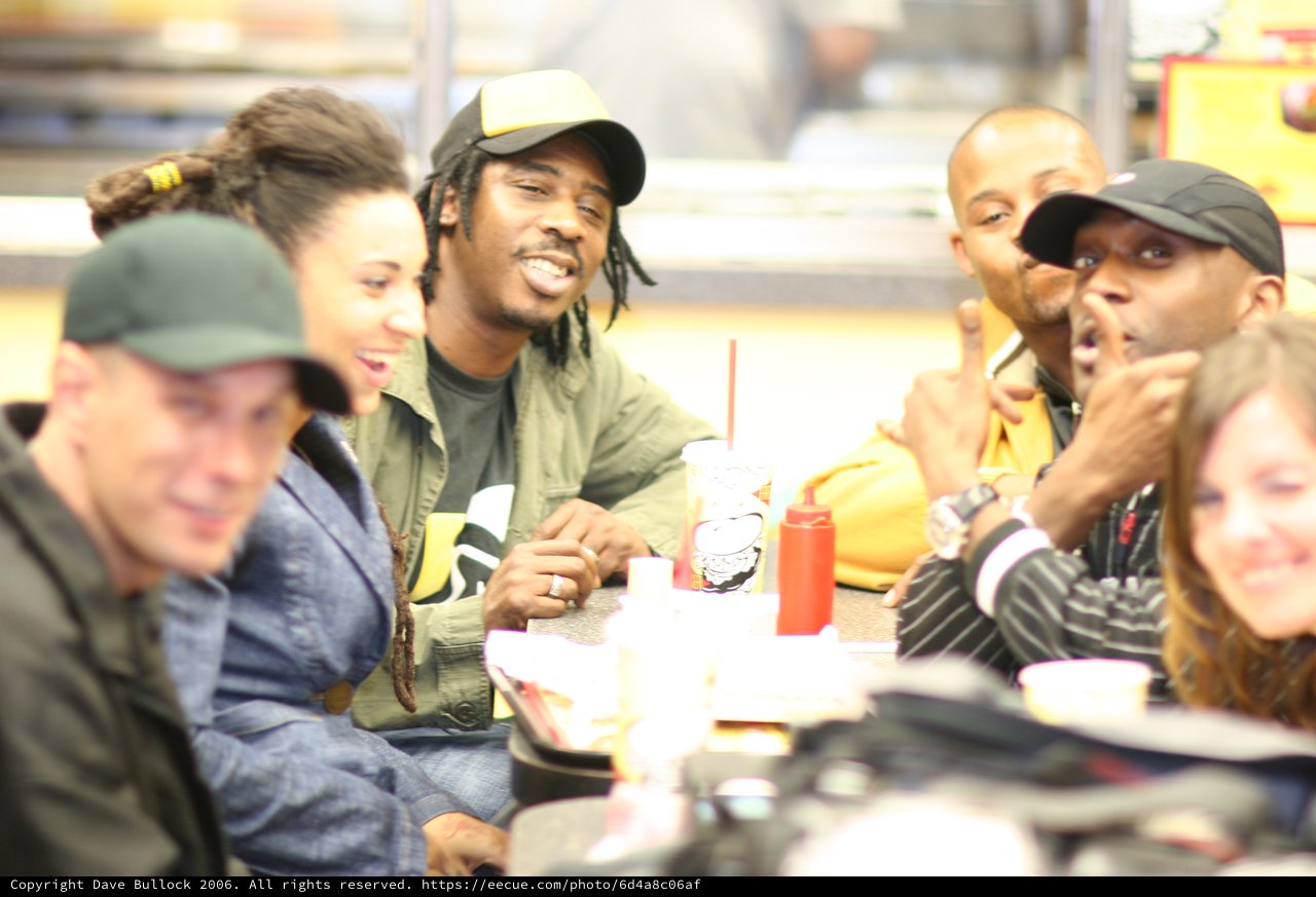 Friends Laughing Together at Fast Food Restaurant