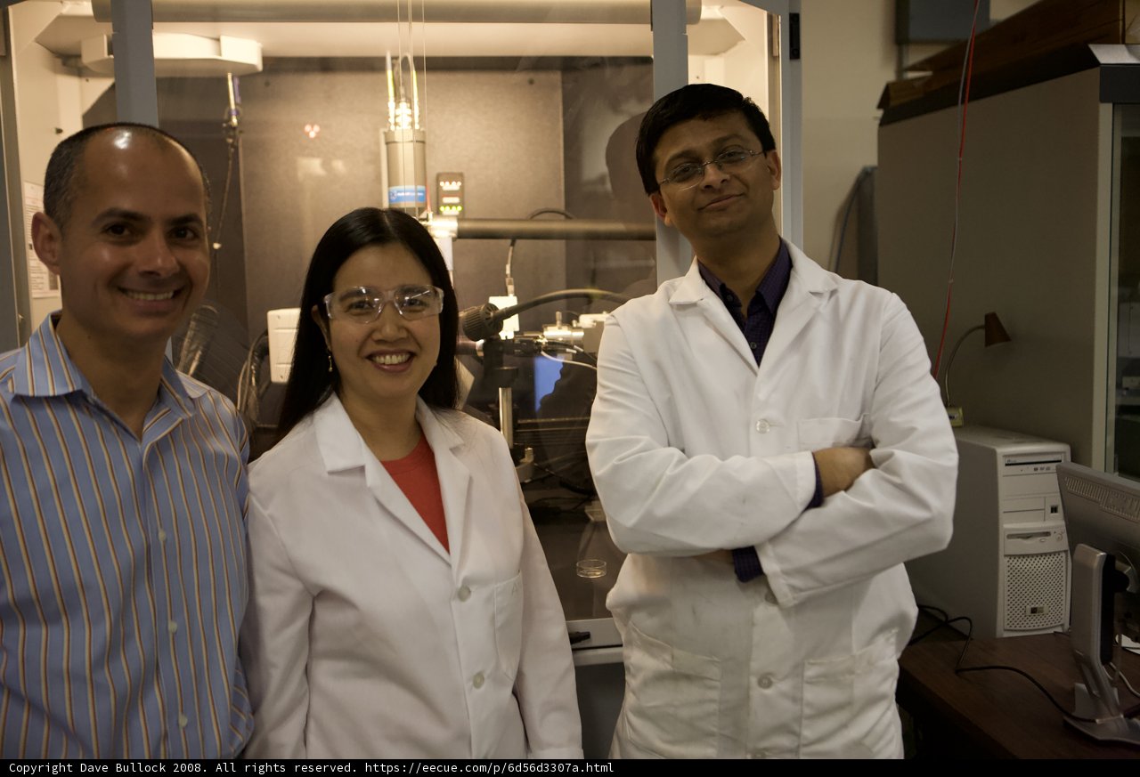 Three Scientists in Lab Coats
