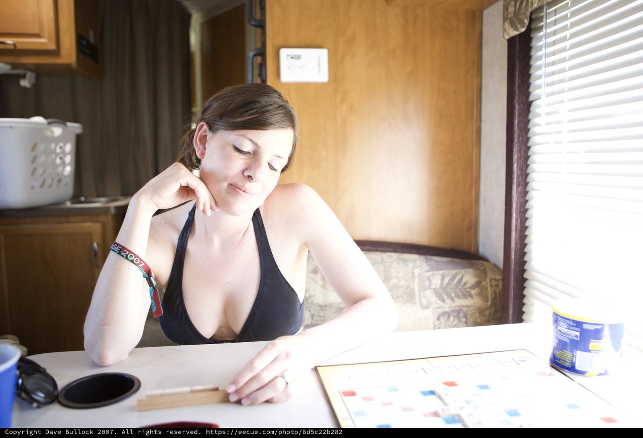 Woman Contemplates Her Scrabble Move in RV