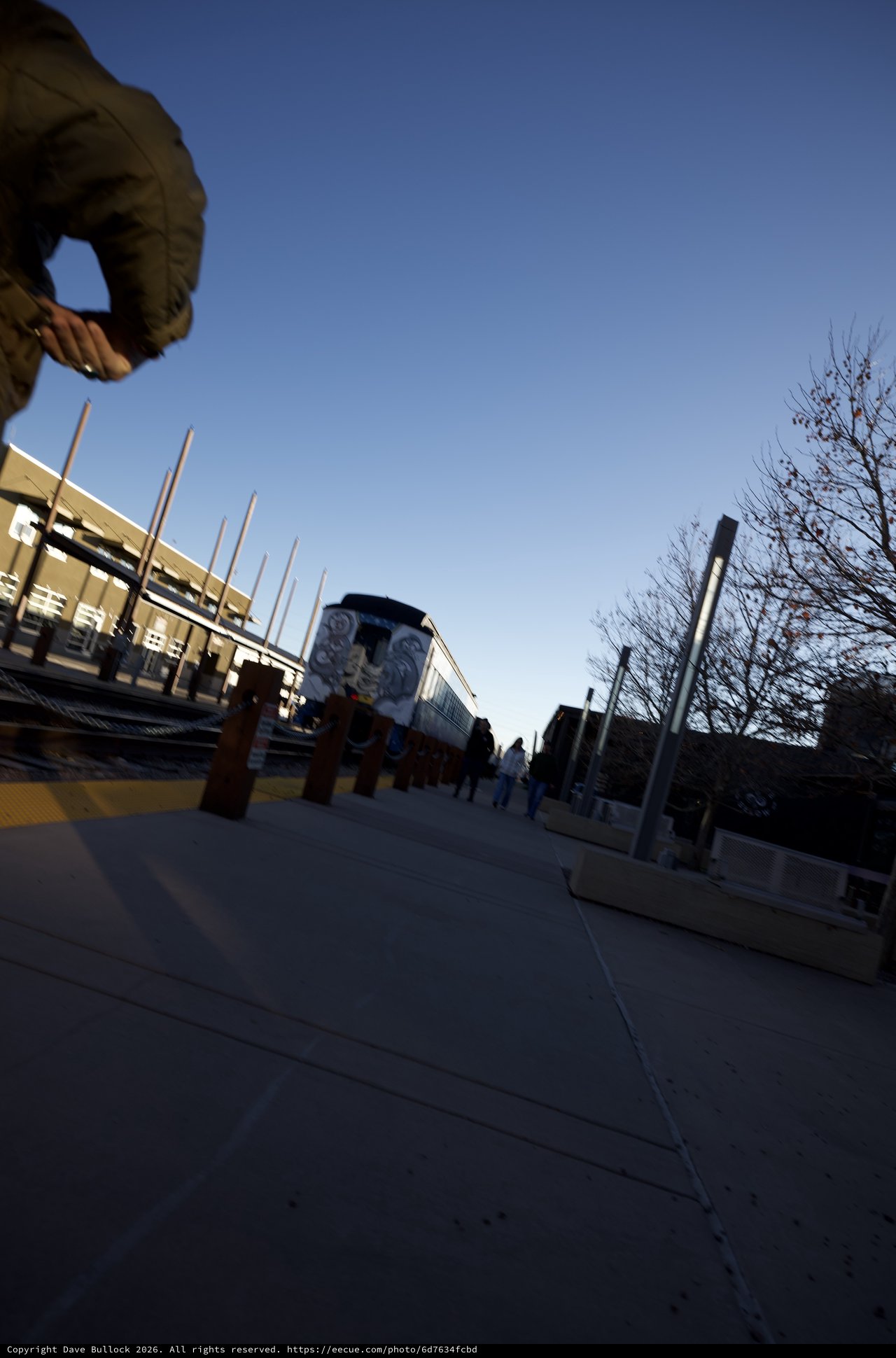 Low Angle Urban Plaza with Train Mural at Dusk