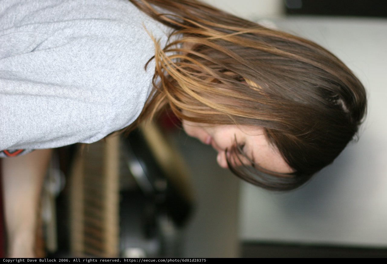 Woman Smiling in Kitchen with Ombré Hair