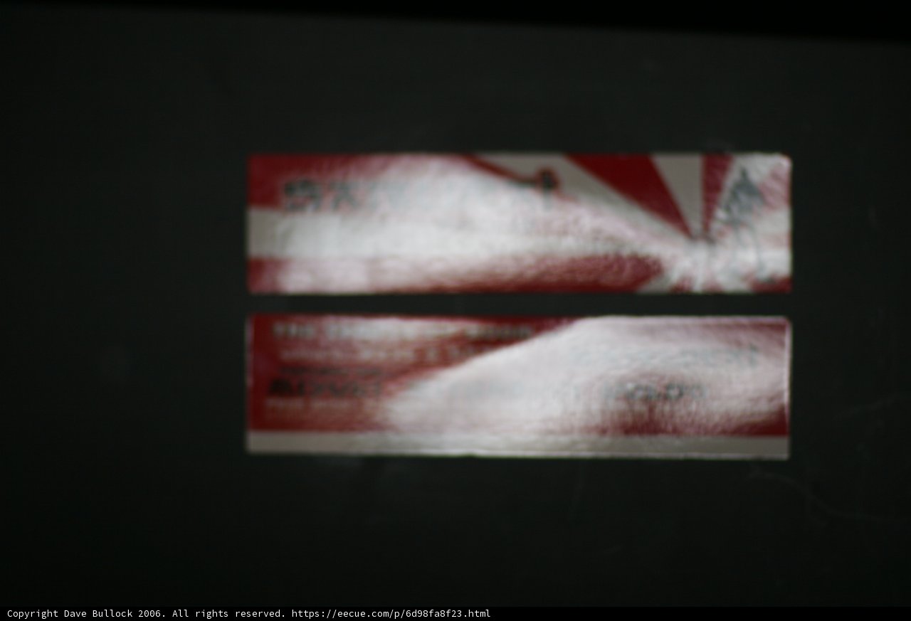 Red and White Stickers on Black