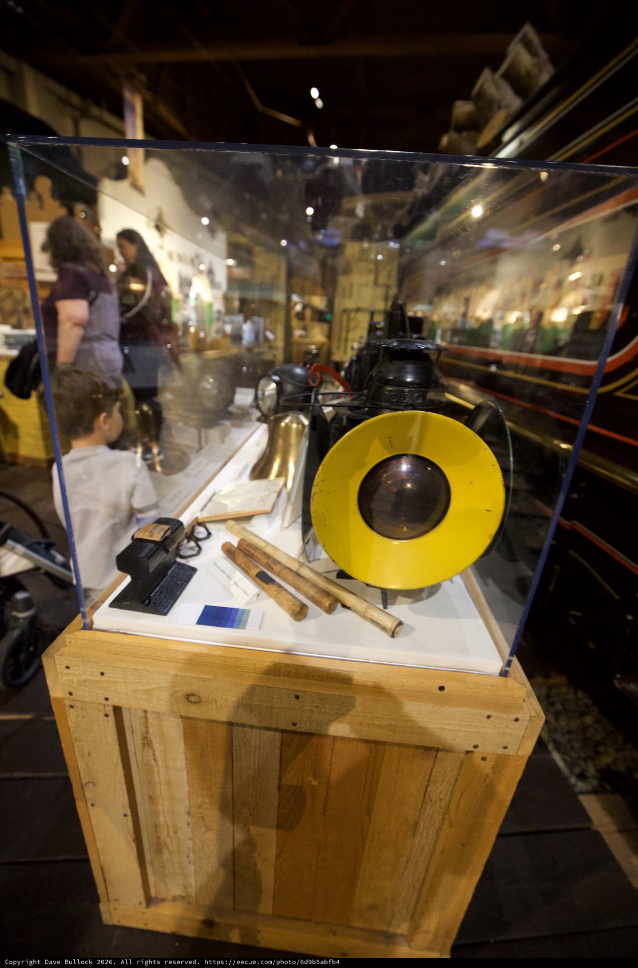 Museum Display Case with Vintage Yellow Record and Scientific Instruments