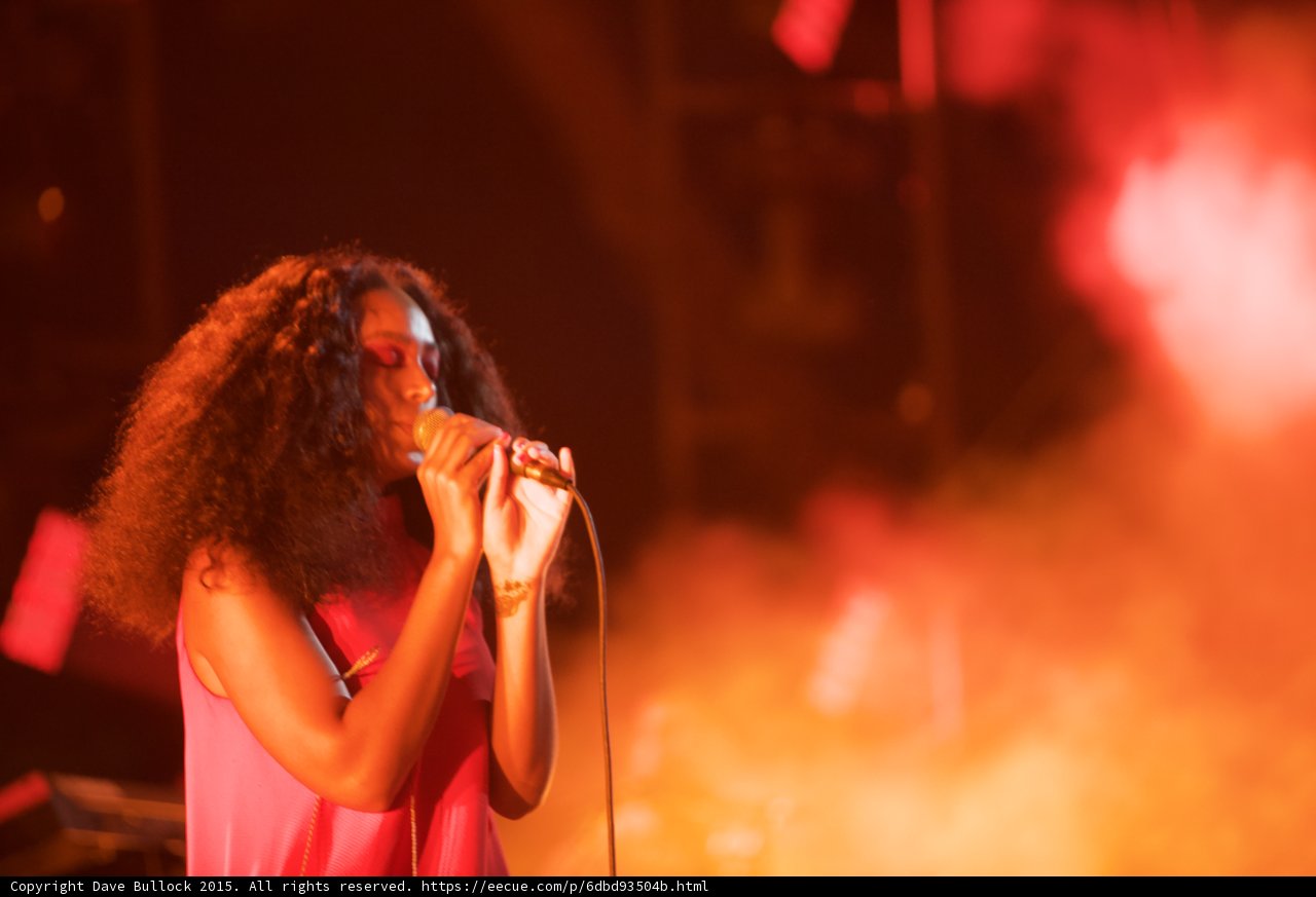 Solange Profile Singing Red Orange Smoke Spotlight Dramatic