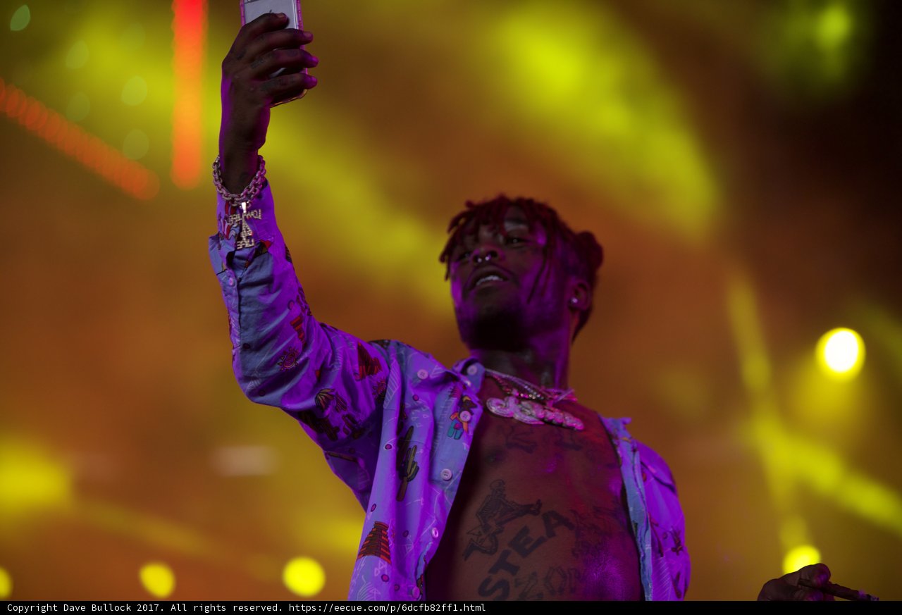 Tattooed Man Captures Coachella Moment on Phone