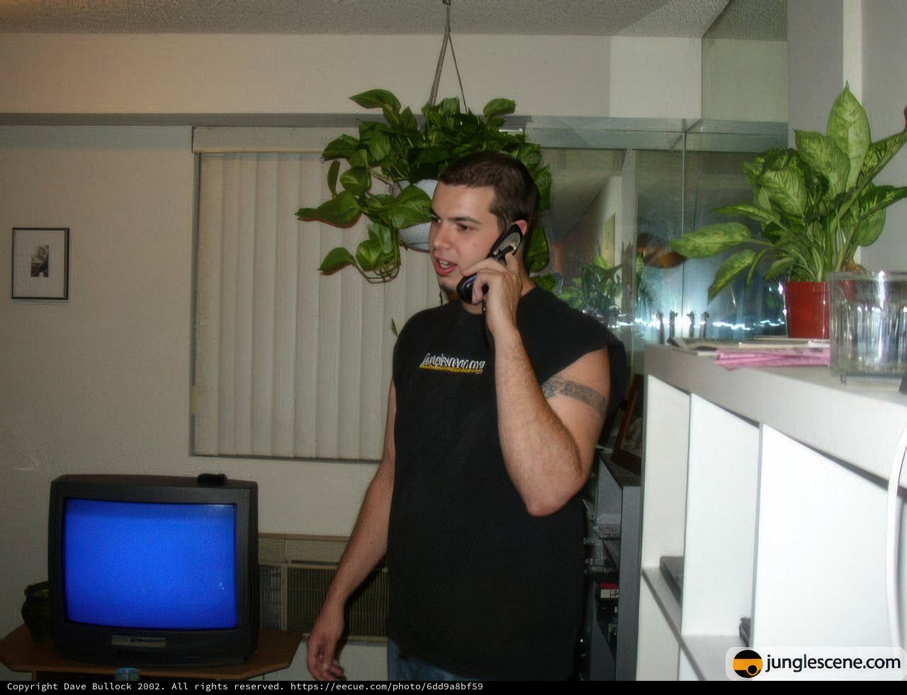 Man on the Phone among Lush Foliage