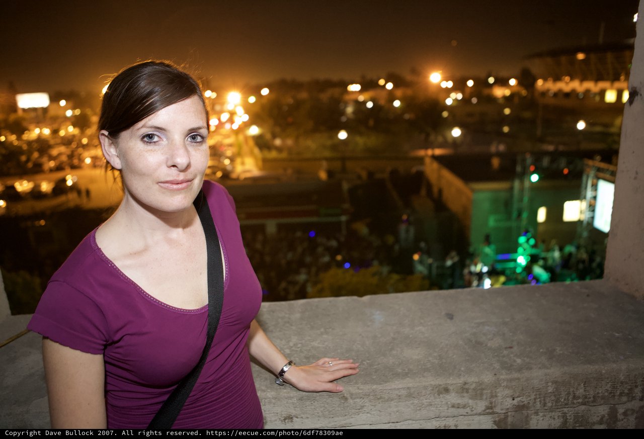 Woman Smiling at Outdoor Night Festival Overlook