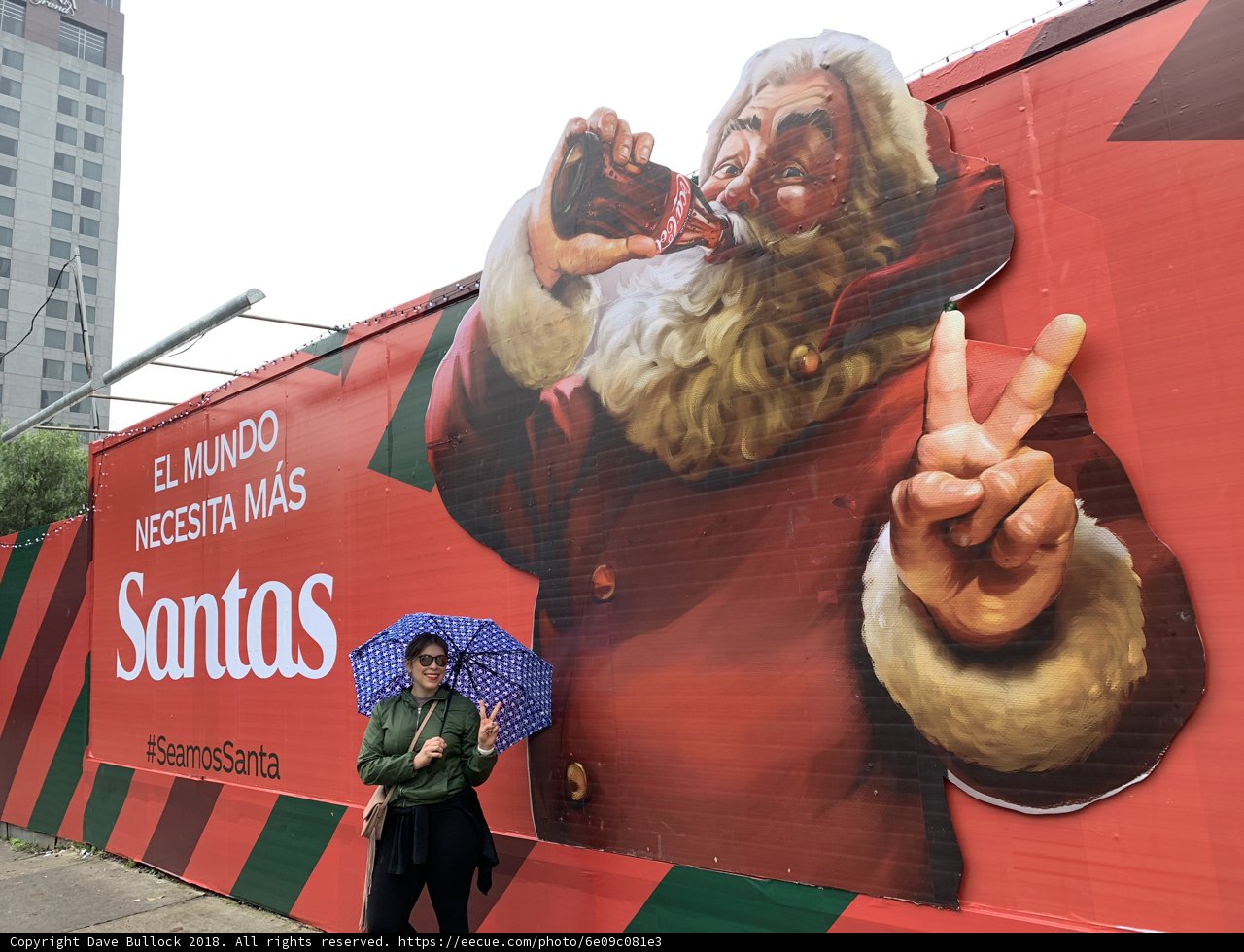 Santa Claus Billboard and the Man with the Umbrella