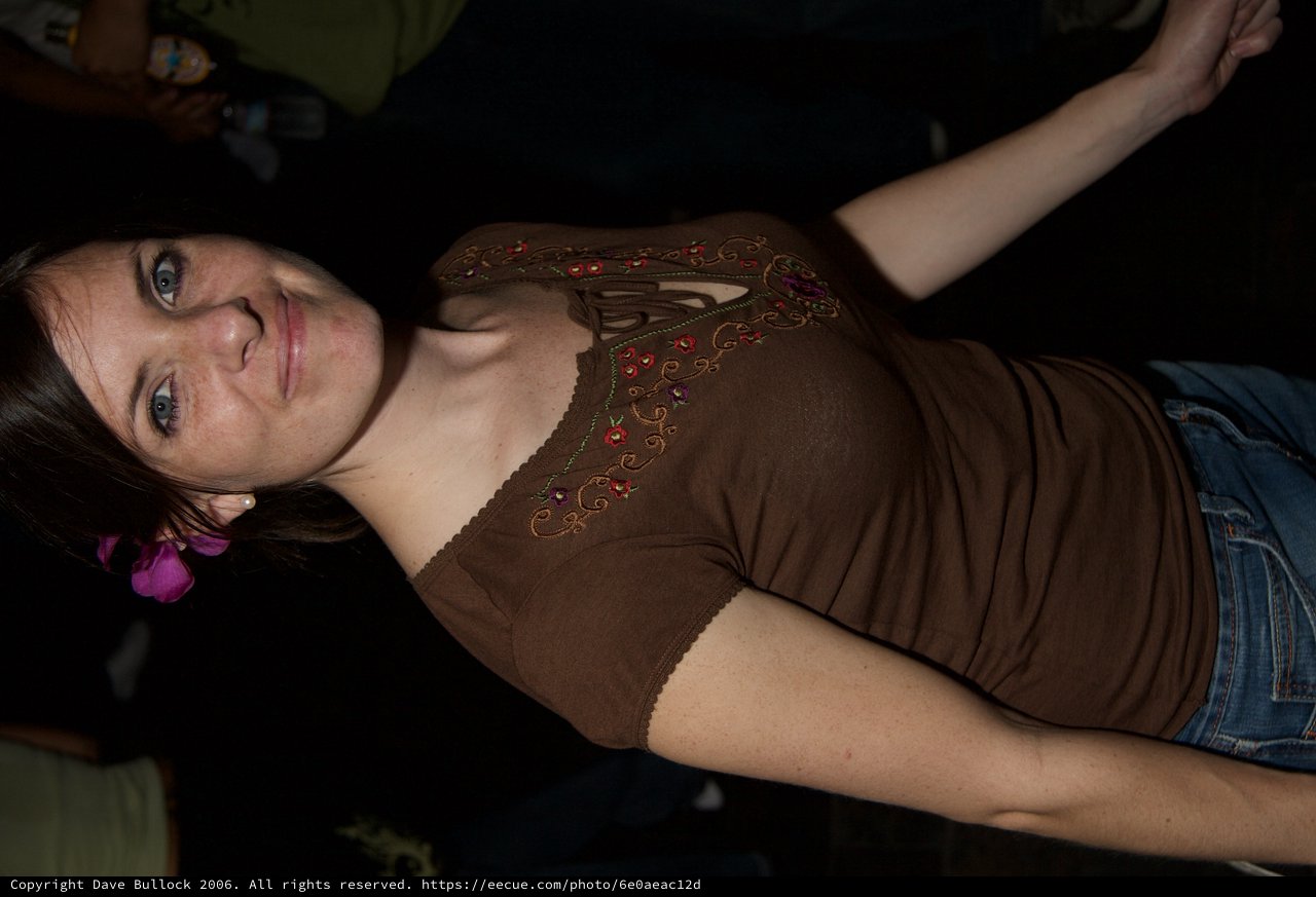 Smiling Woman with Pink Flower at Art Walk