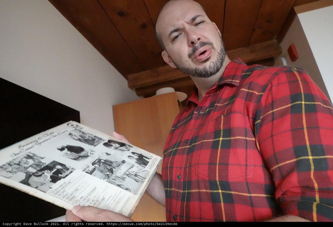 Man Reading Newspaper in Rustic Interior
