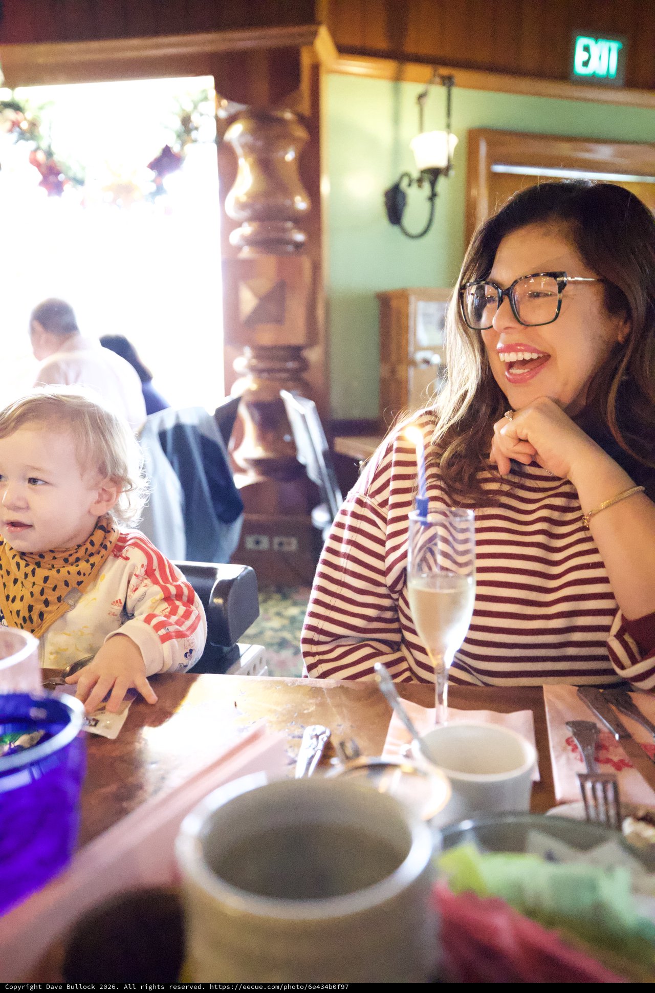 Mother and Child Dining at Restaurant Interior