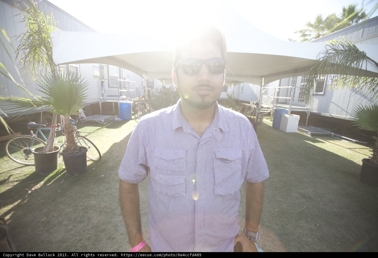 Man in Purple Shirt and Sunglasses Soaking Up the Sun