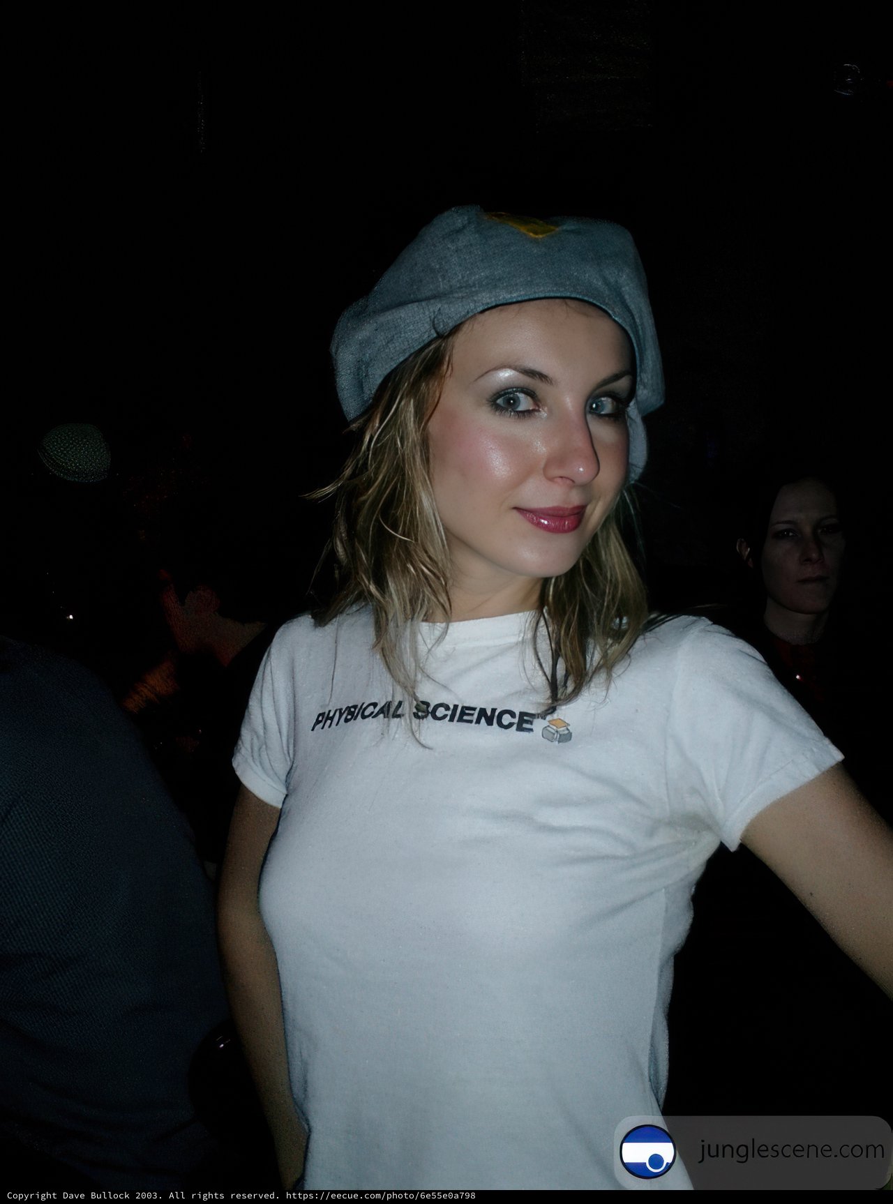 Urban Portrait of a Woman in a Baseball Cap and T-Shirt