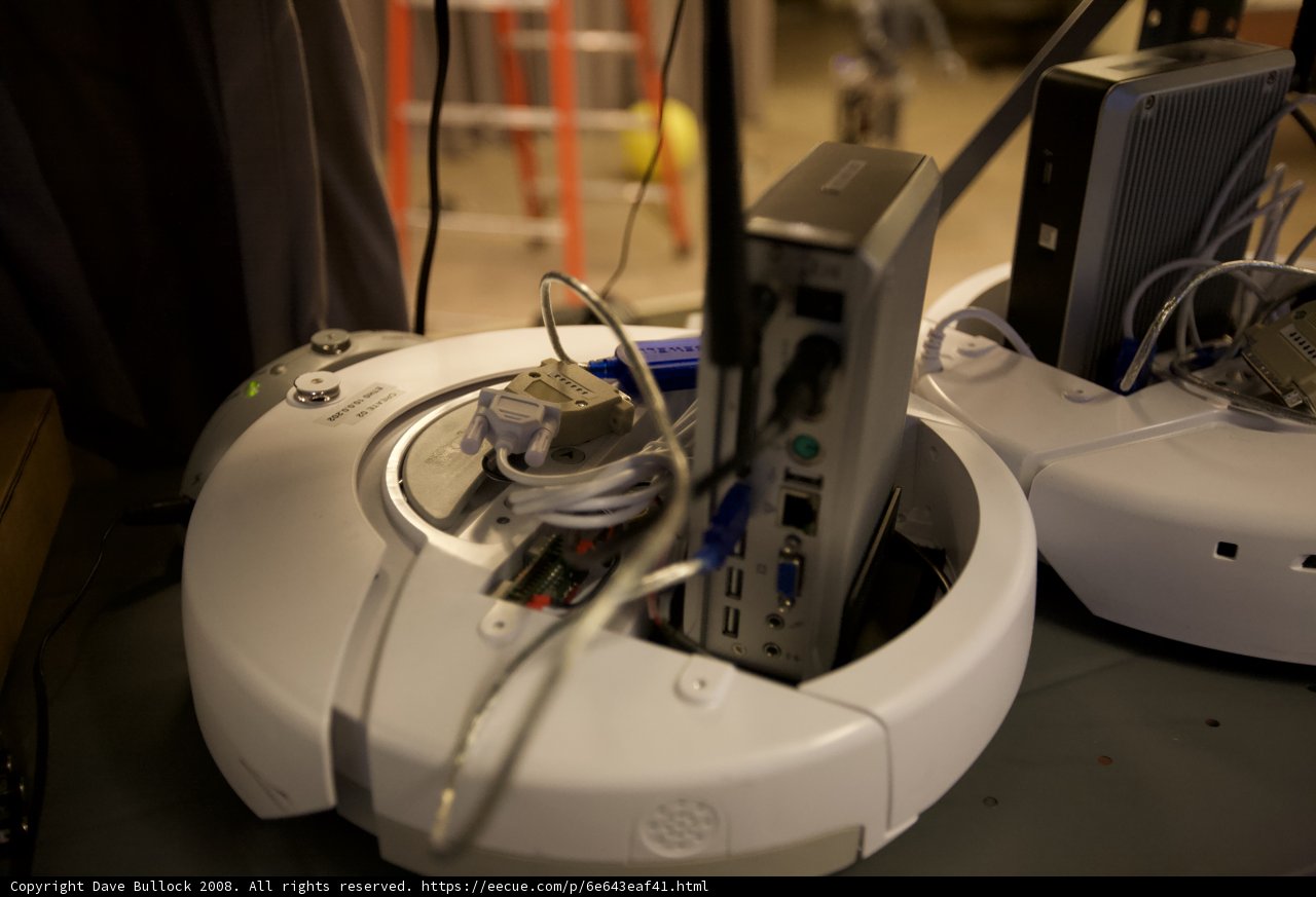 White Robot with Computer and Mouse