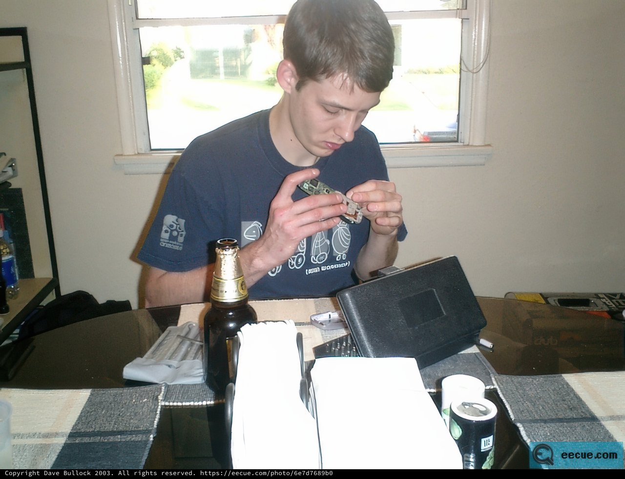 Man Working and Drinking Beer at Table