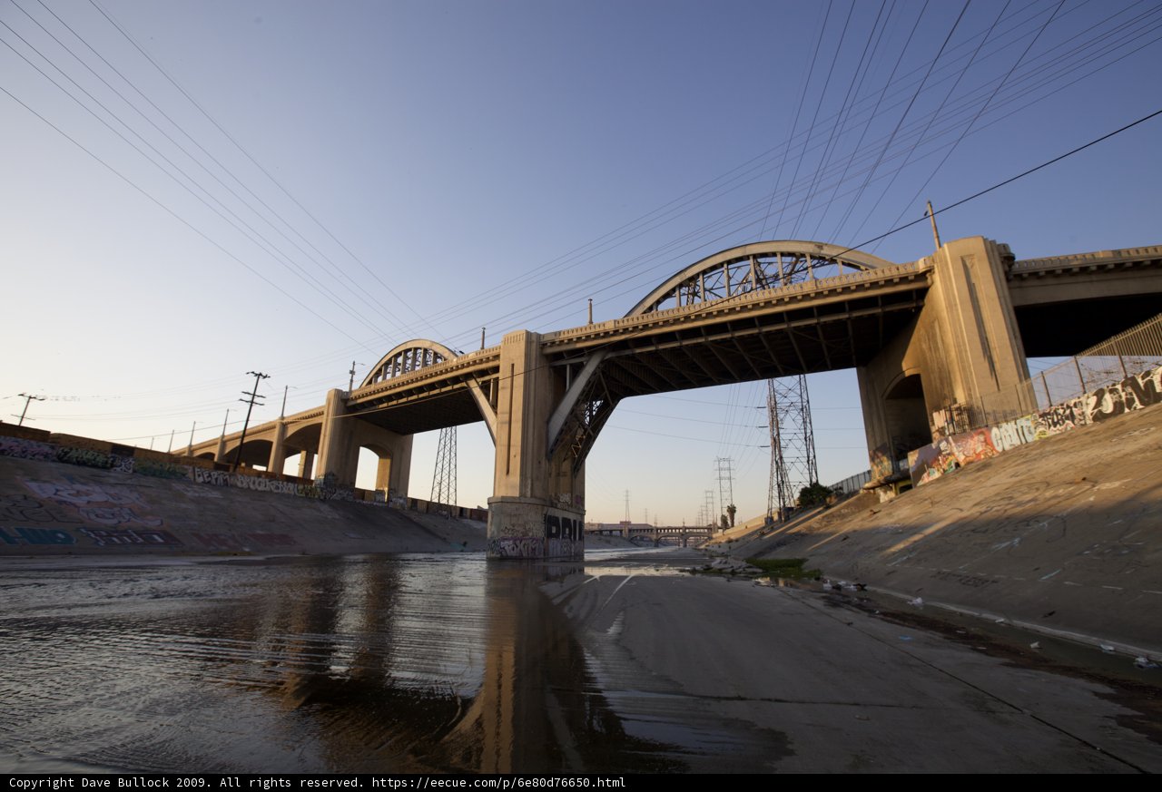 Arching Overpass Above a Glistening River