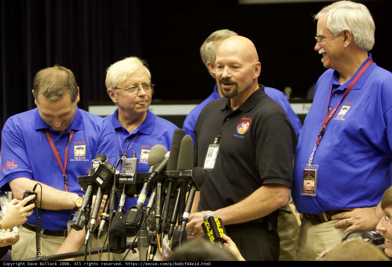 Press Conference with a Crowd of Men