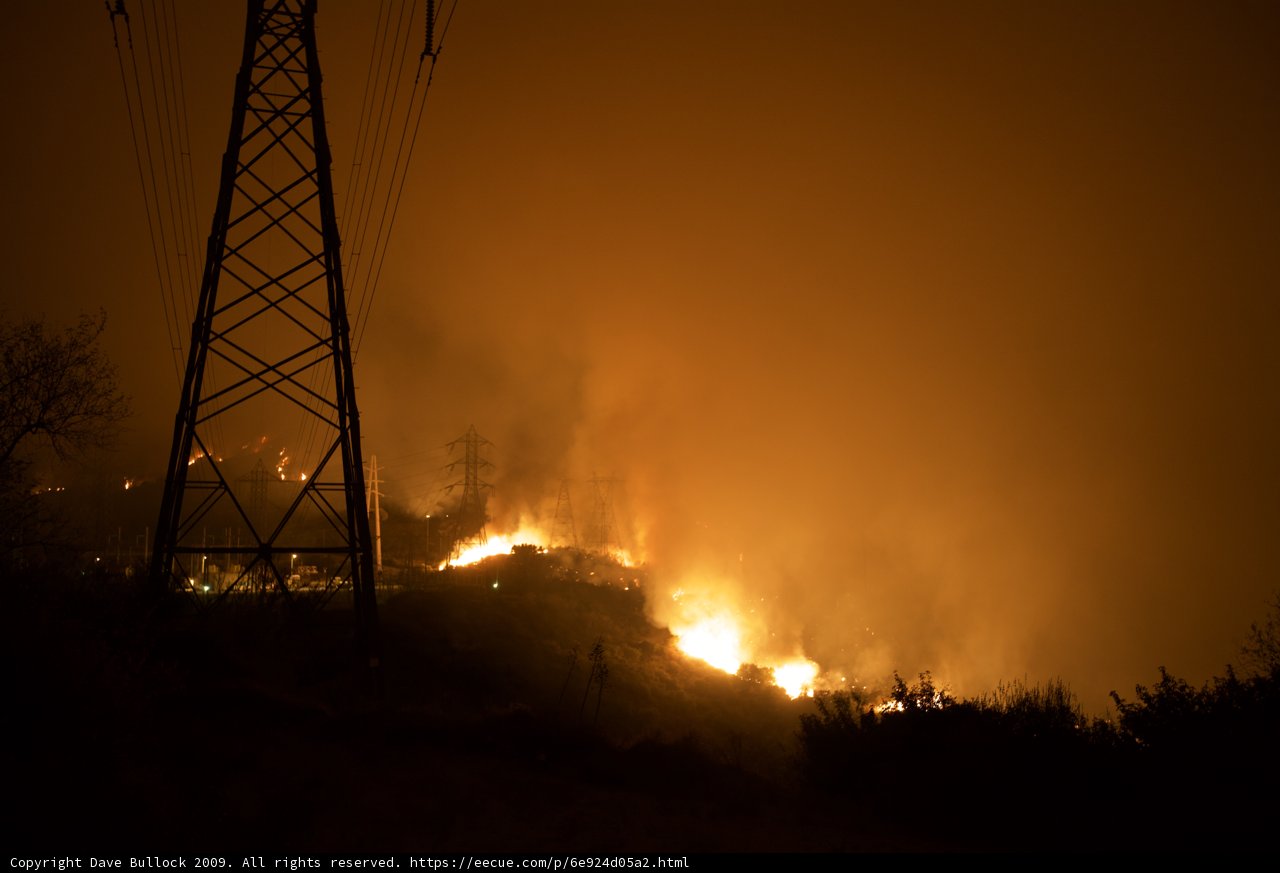 Burning Hillside Near Power Lines