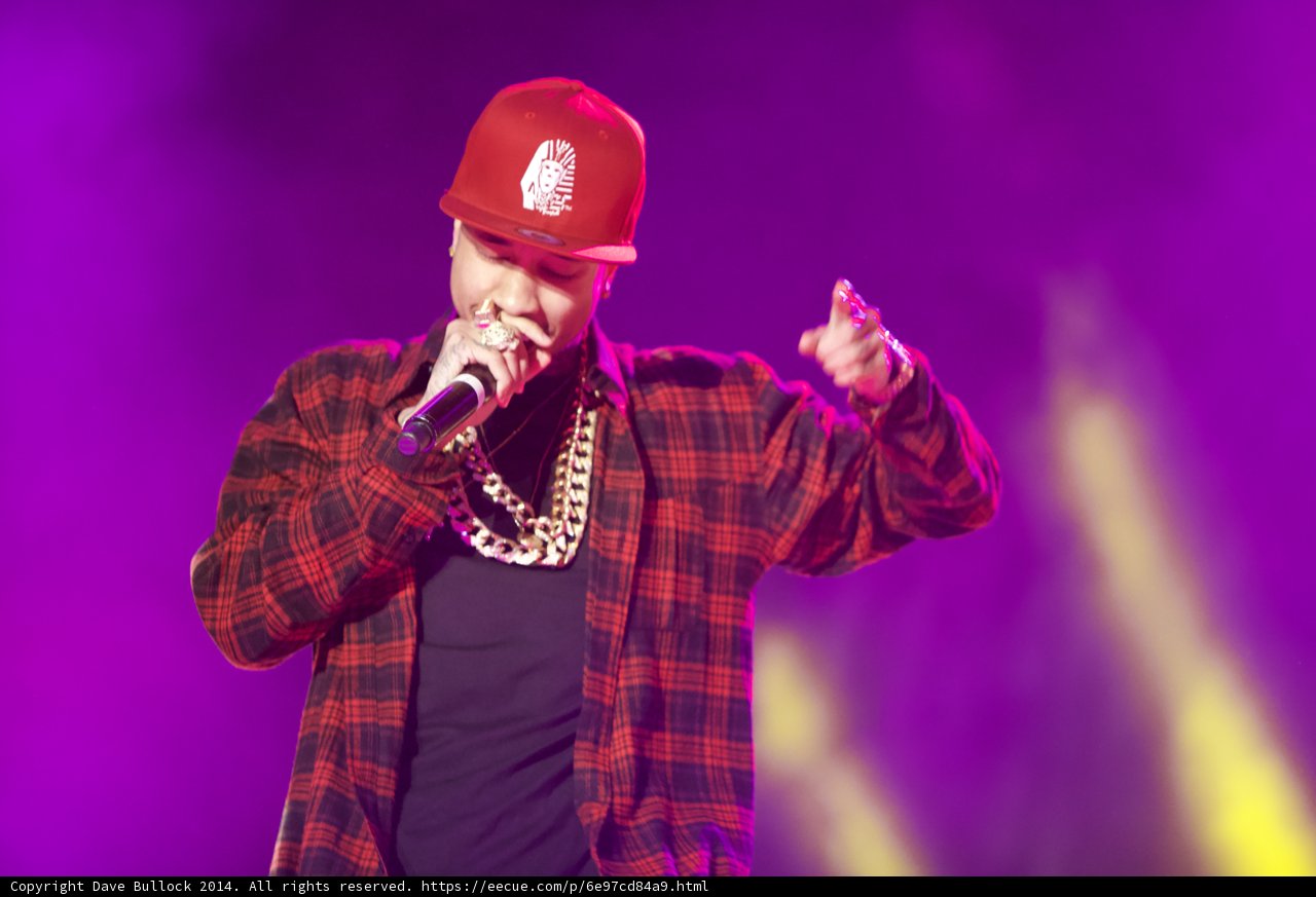 Tyga Takes the Stage in a Red Hat and Plaid