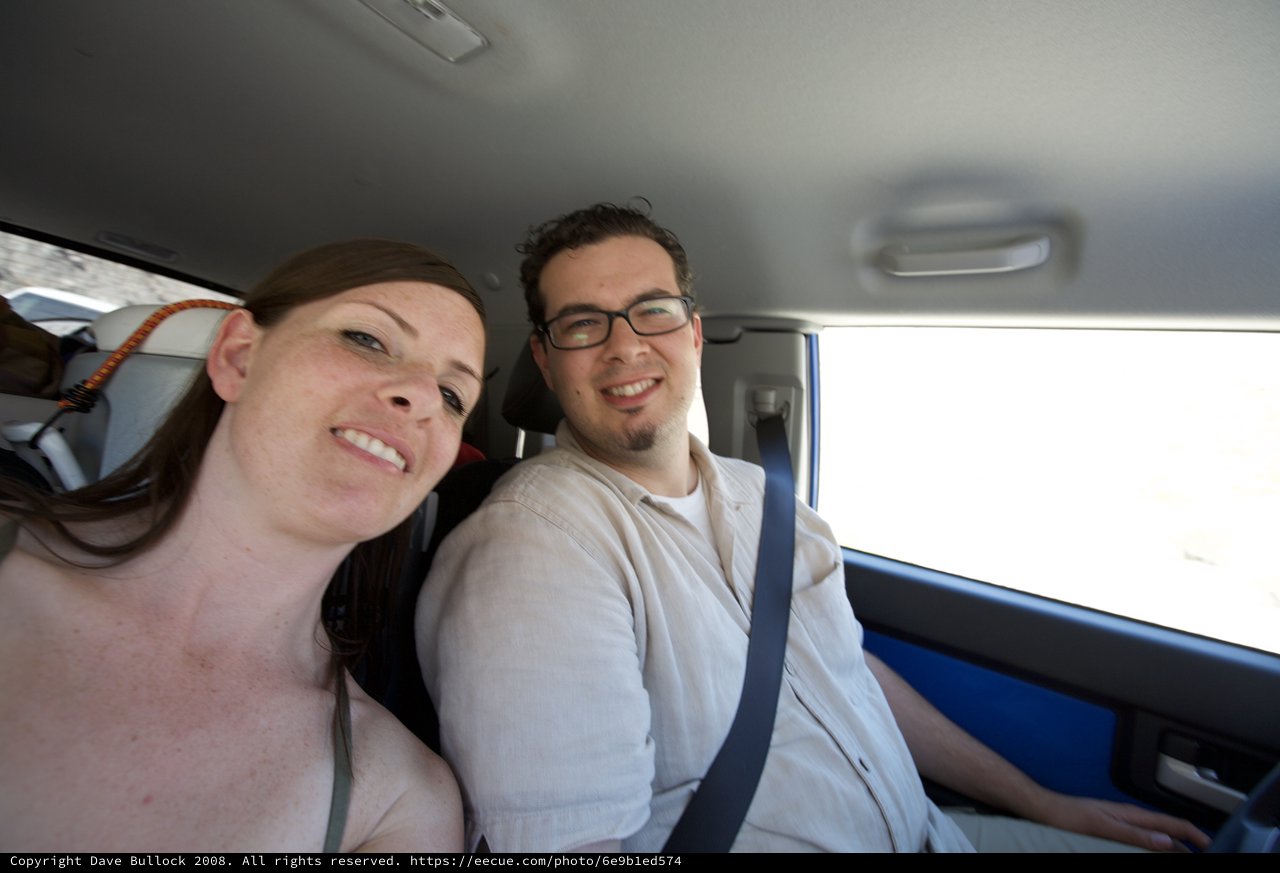 Dave and Penelope Smiling on a Desert Road Trip
